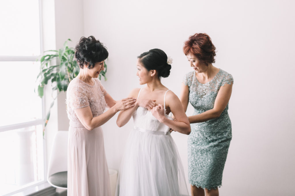 Mother's helping bride get ready