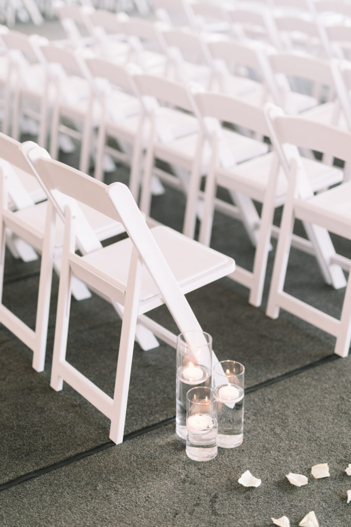 Detail ceremony photo of chairs and candles