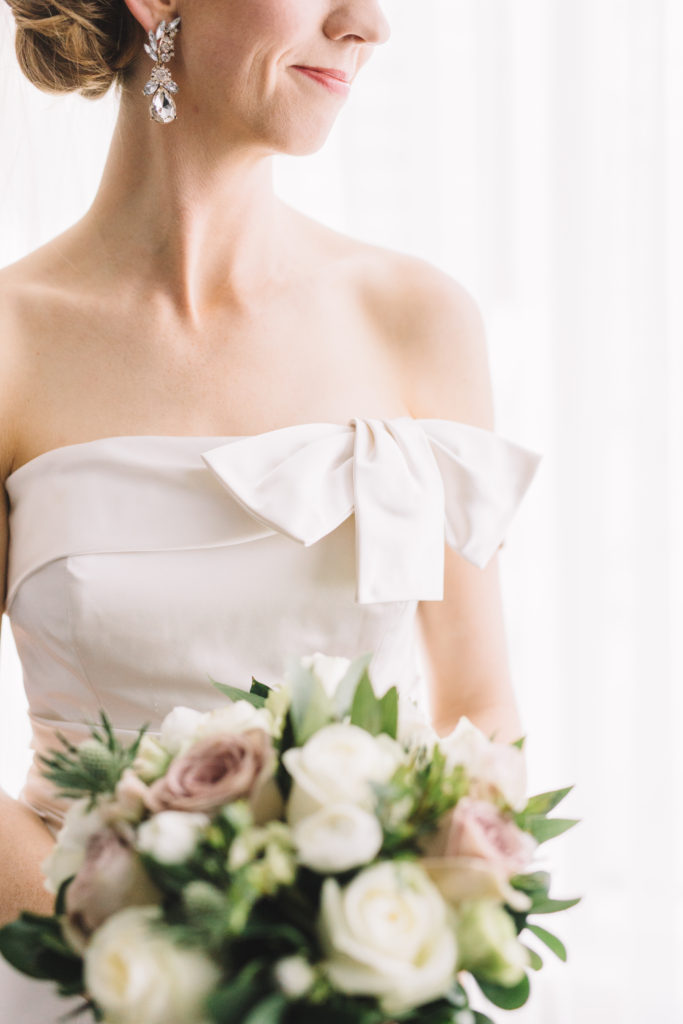 Detail photo of bride with flowers