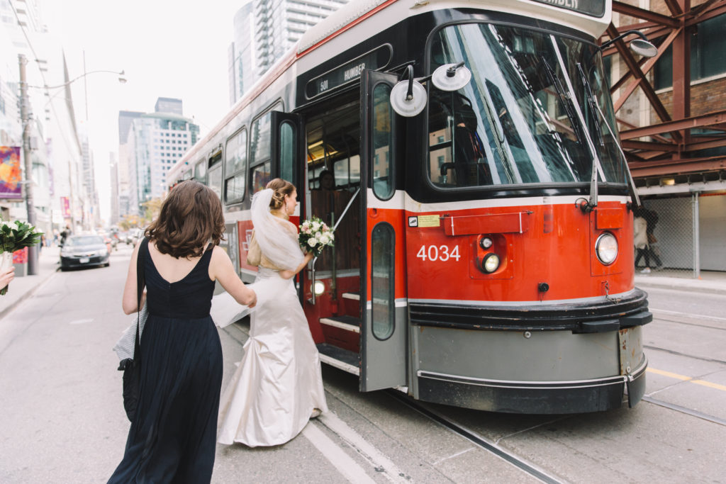 Bride getting onto streetcar