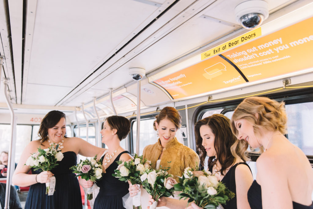 Bride and bridesmaids on streetcar in Toronto