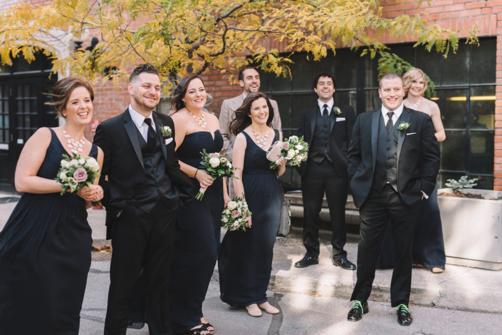 Bridal party watch and laughing