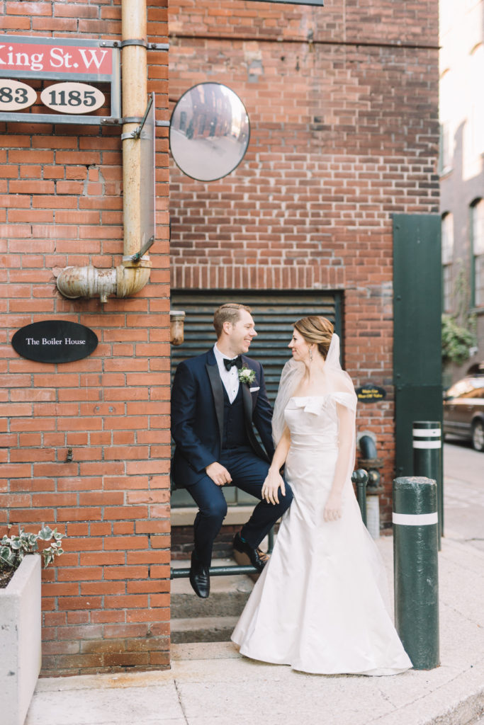 Bride and groom hanging in the Liberty village