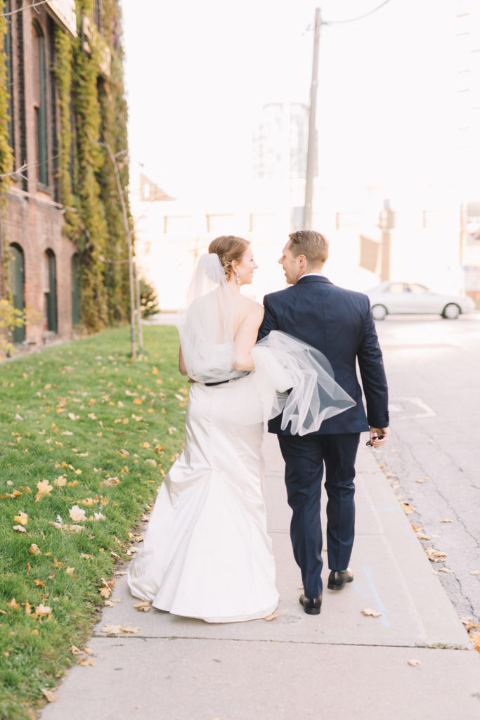 Bride and groom walking in Liberty Village in Toronto
