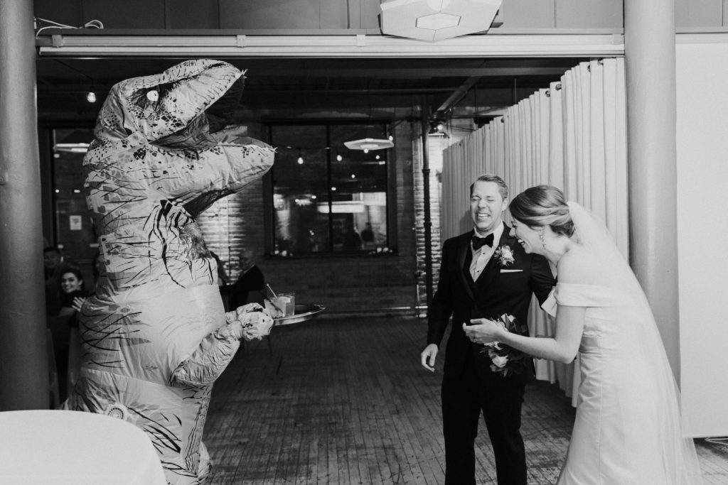 Groom surprises bride with dinosaur