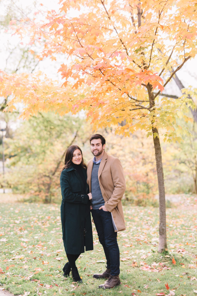 Portrait of couple under fall tree