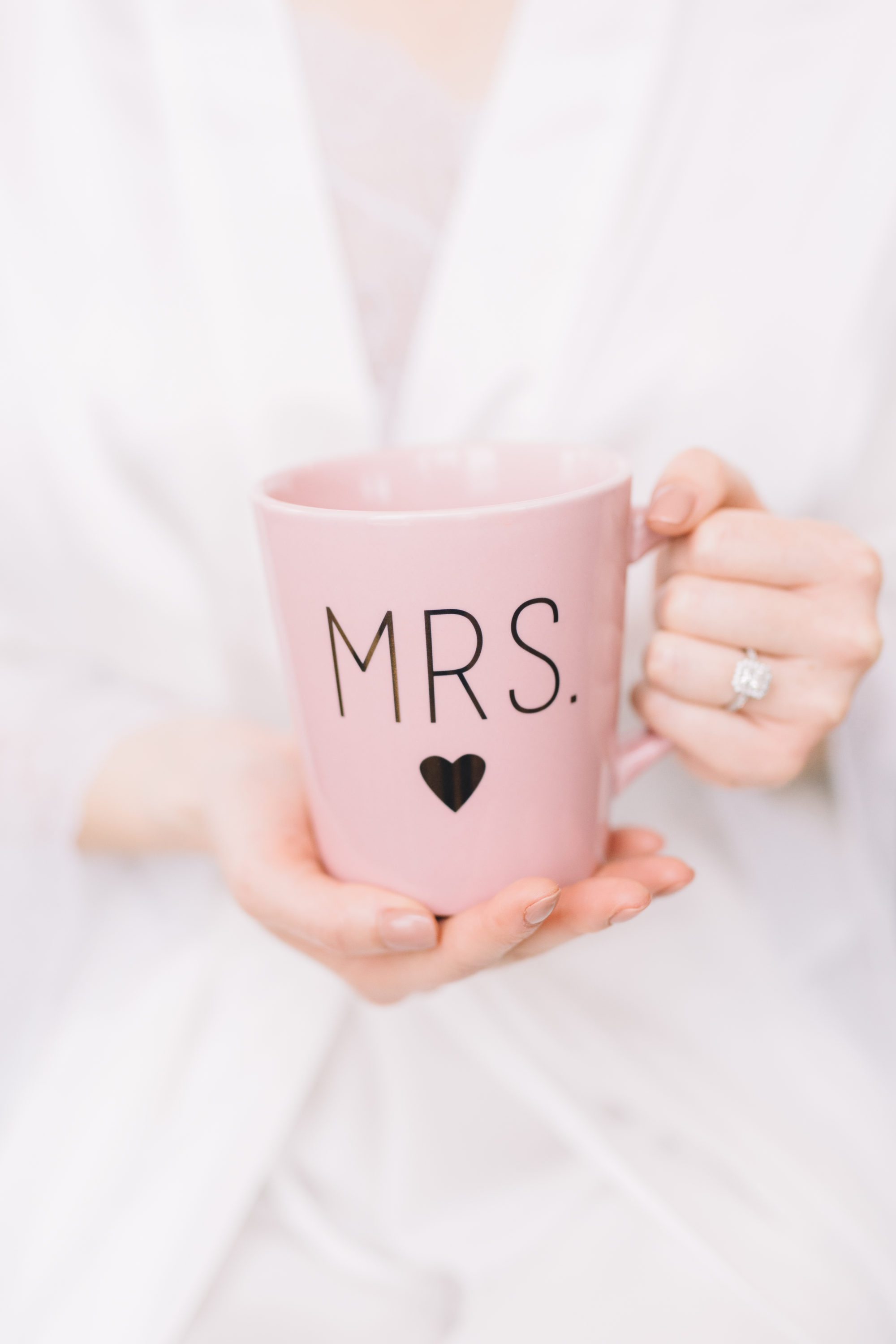Bride holding coffee cup