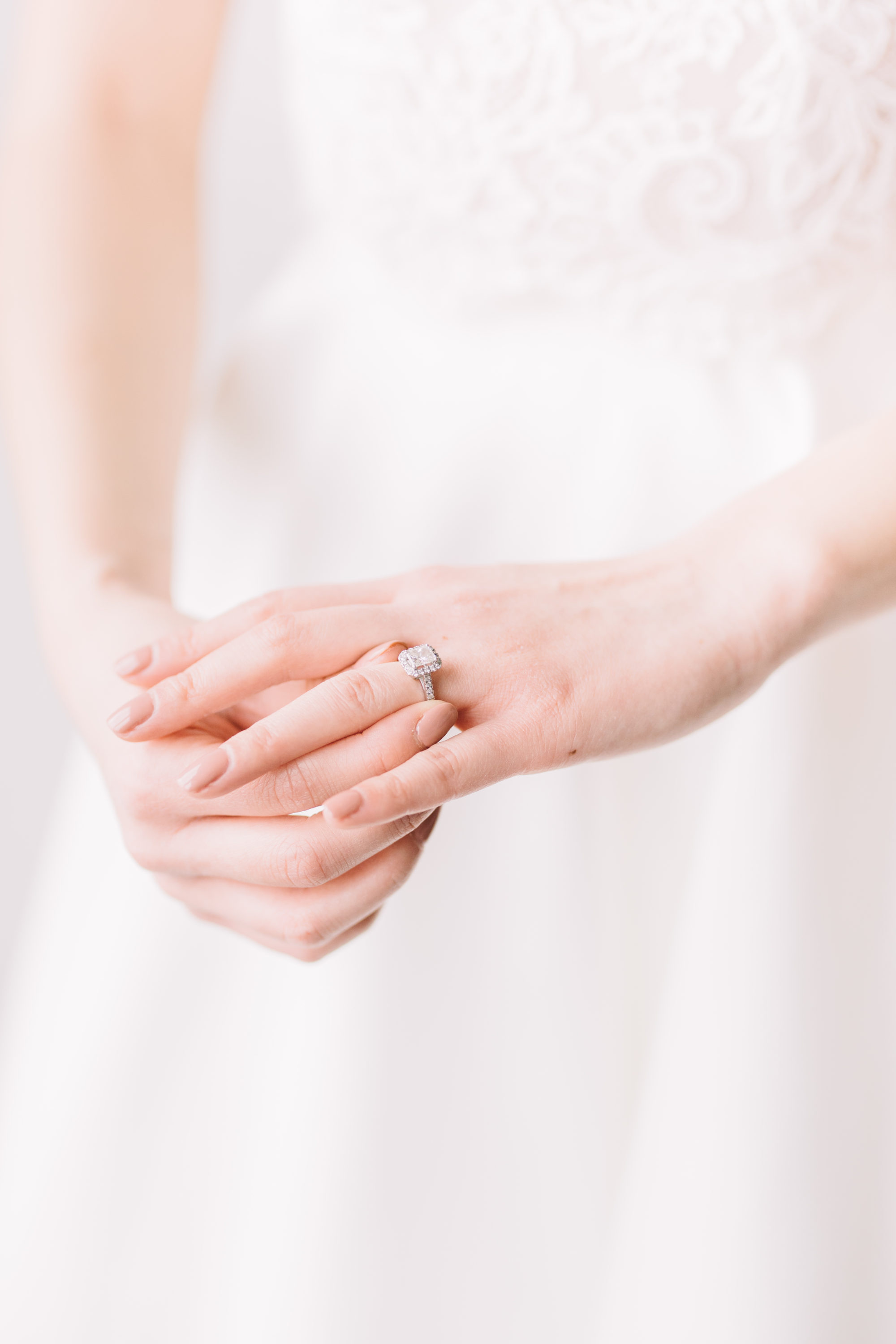 Bride adjusting engagement ring