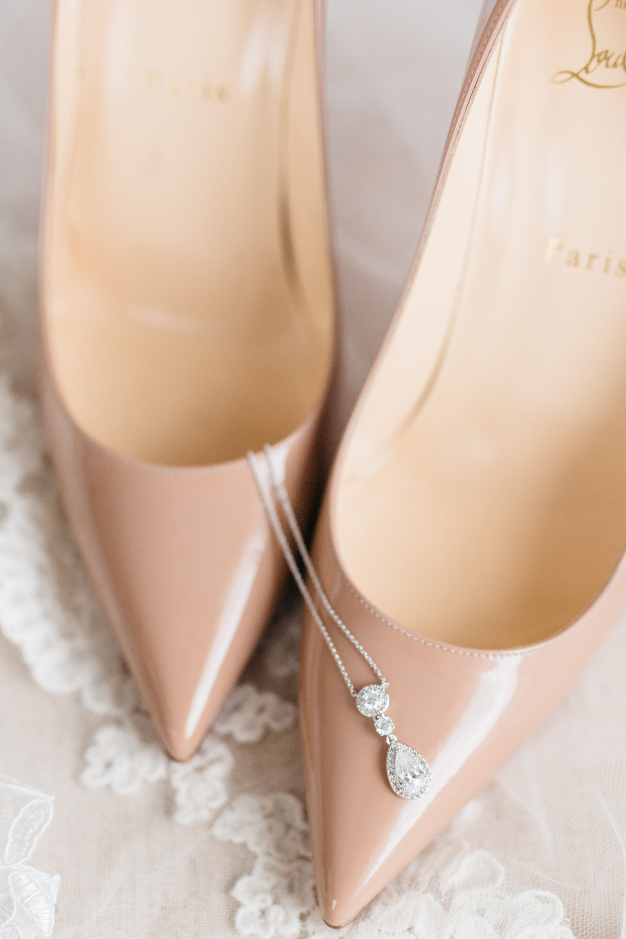 Bride's necklace and Louboutin shoes