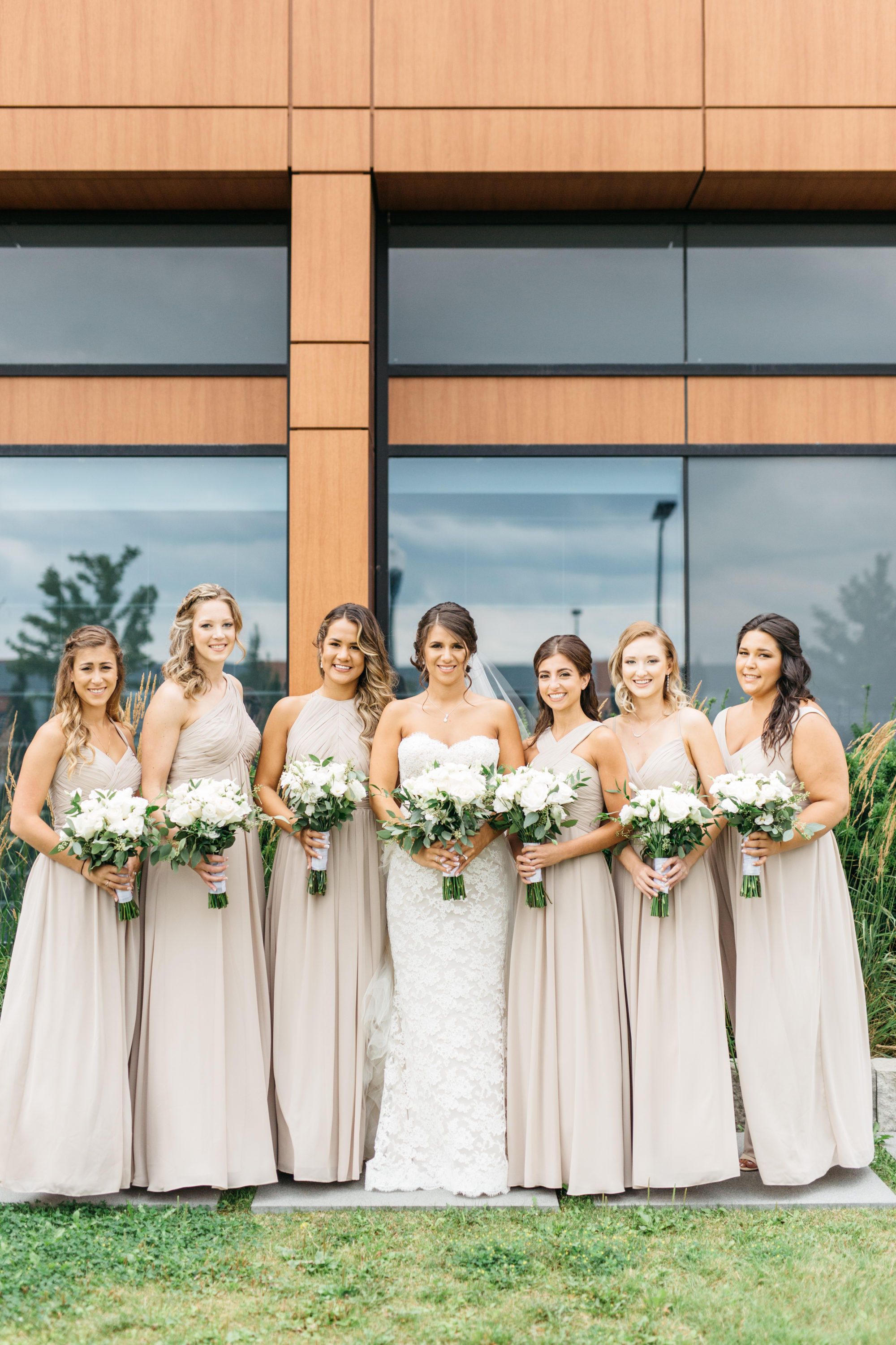 Bride with bridesmaids outside of Elements Vaughan Southwest Hotel
