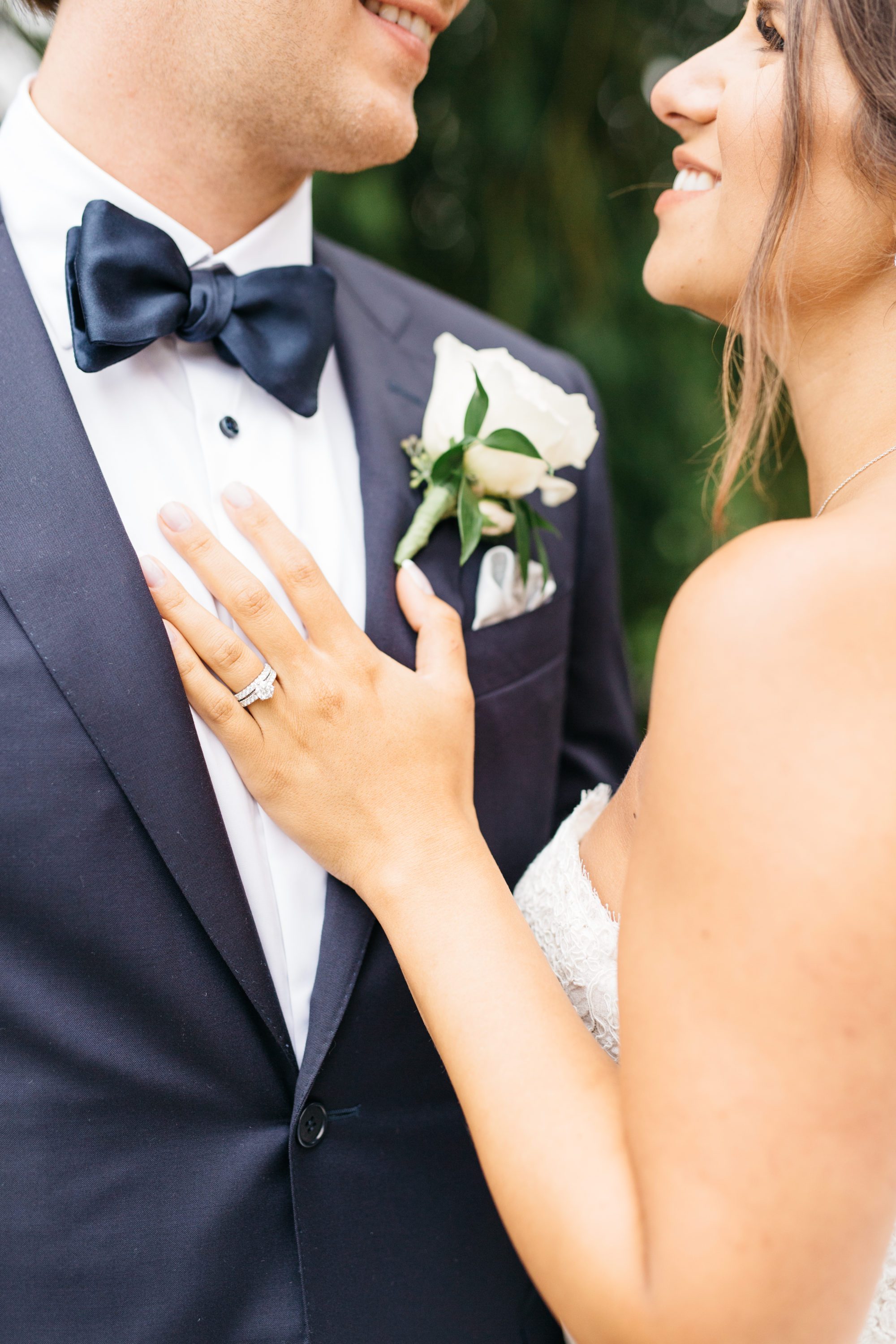 Bride's hand on grooms chest