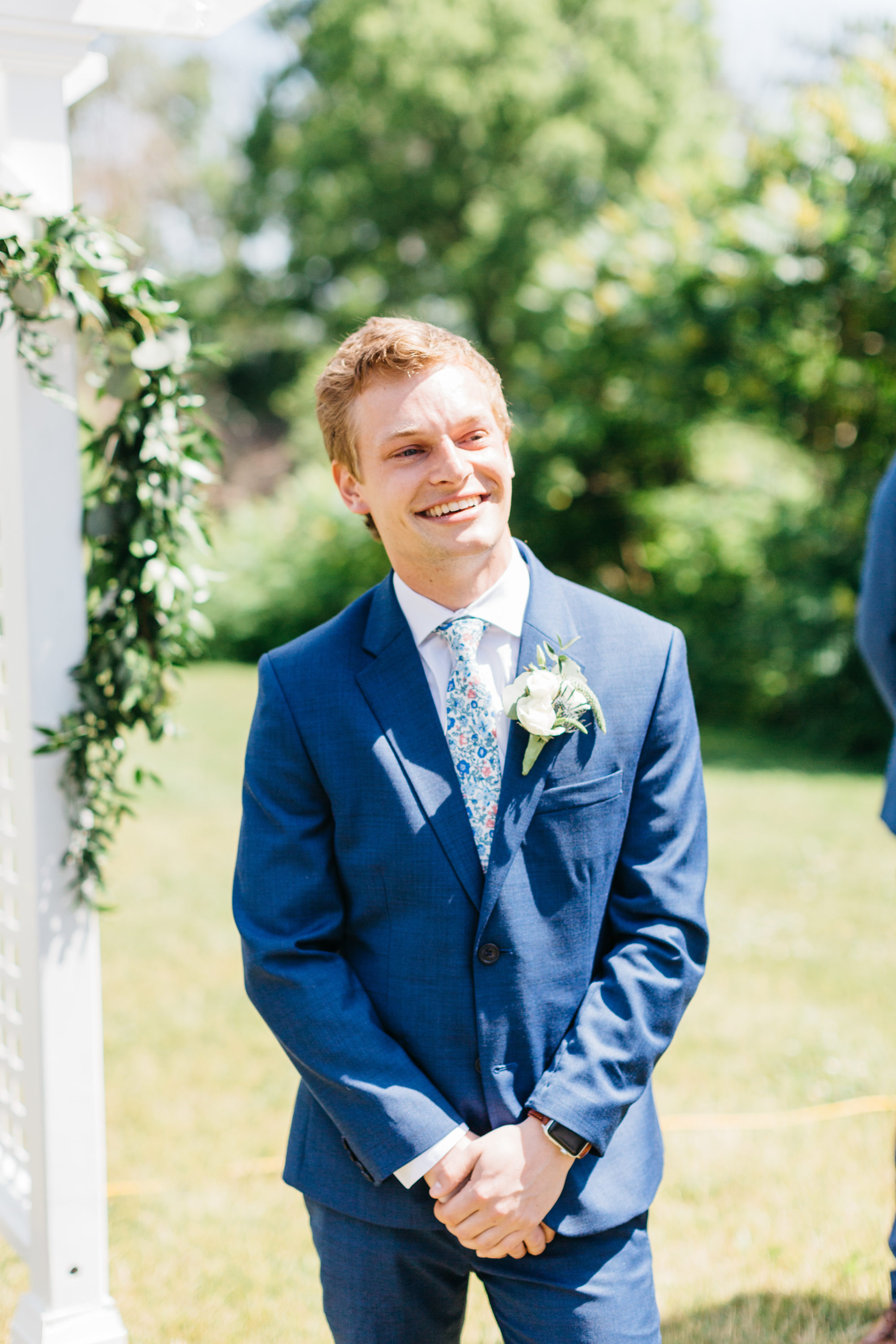 Groom smiling at his bride