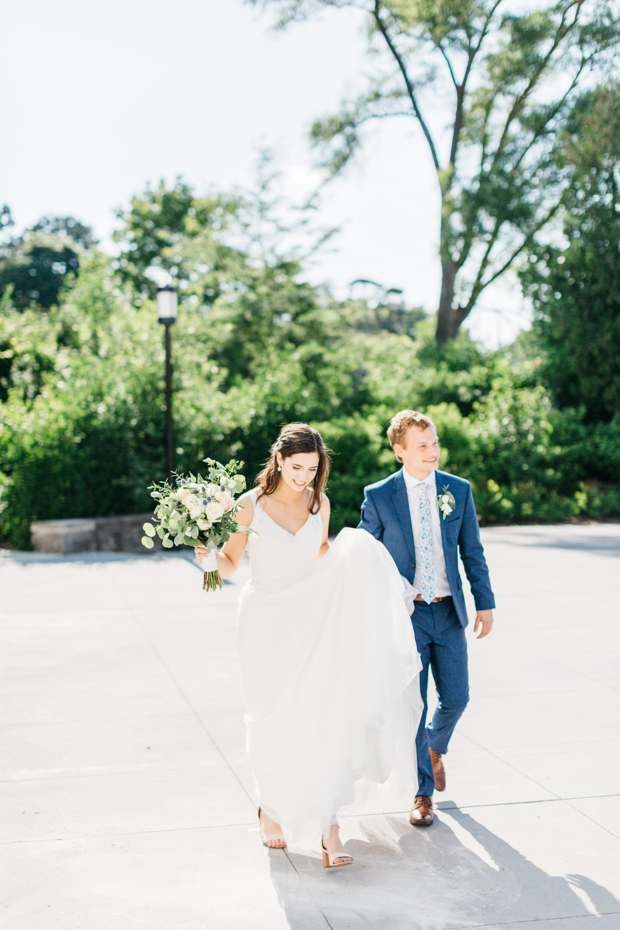 Bride and groom walking on driveway at Harding Waterfront Estate Wedding