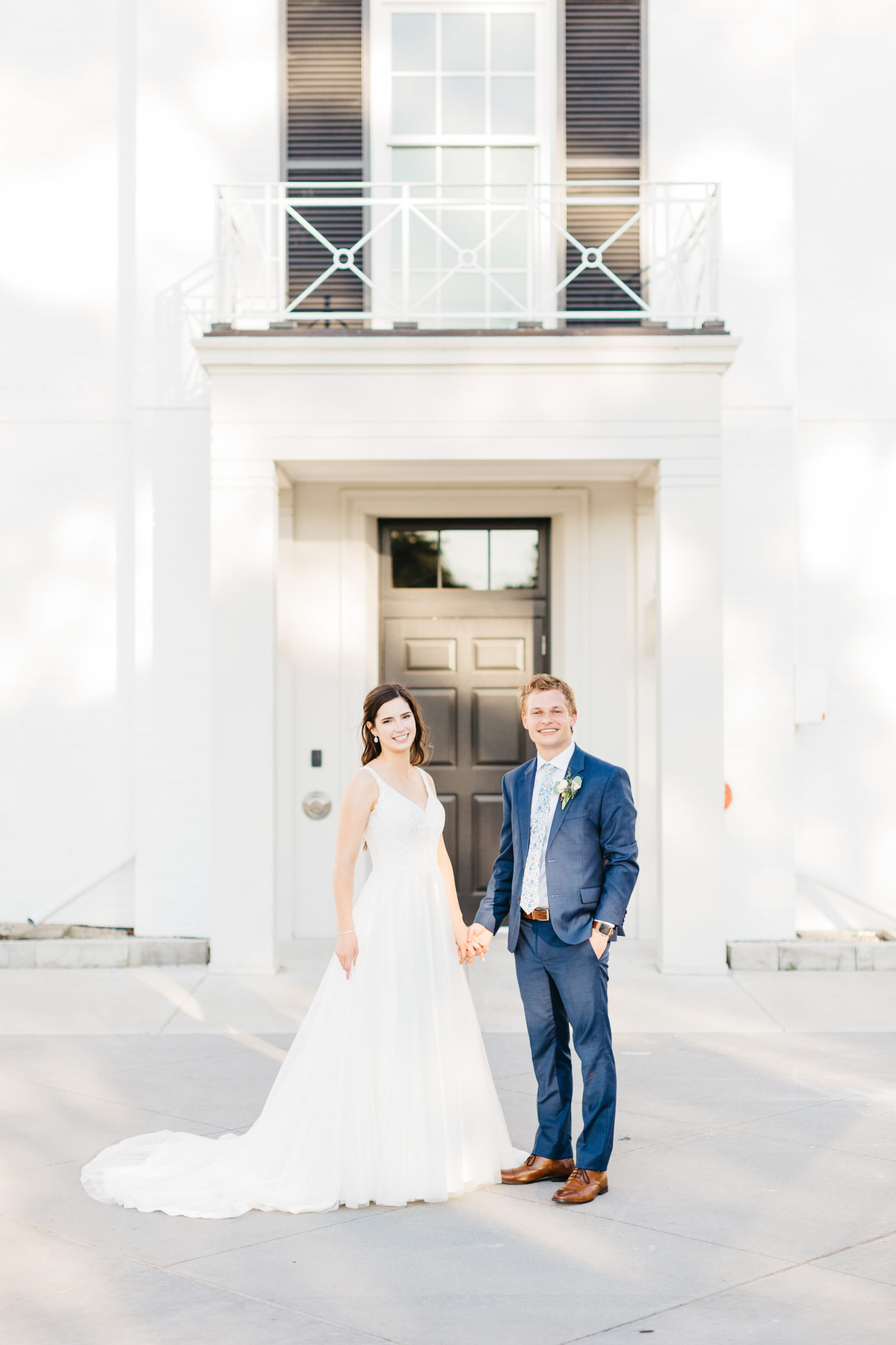 Bride and groom in front of front doors at Harding Waterfront Estate