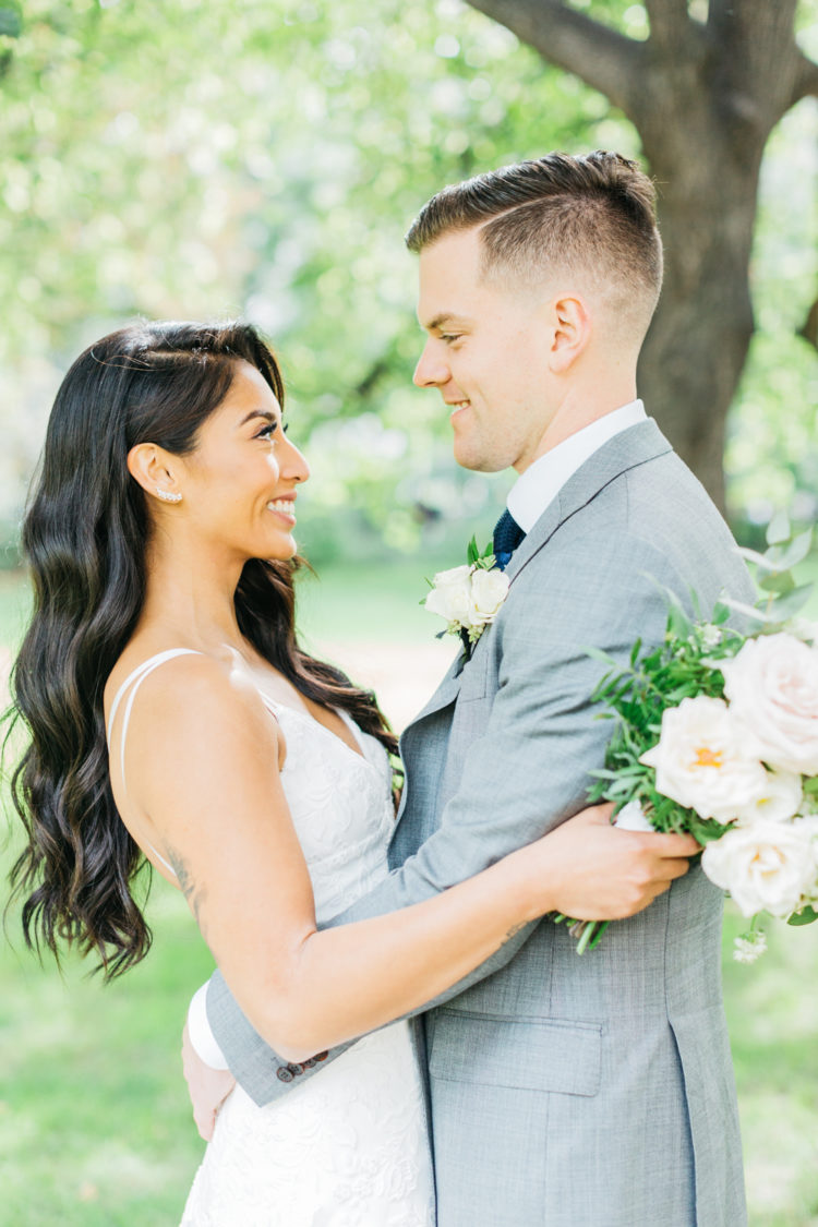 Bride and groom looking at each other at Osgoode Hall