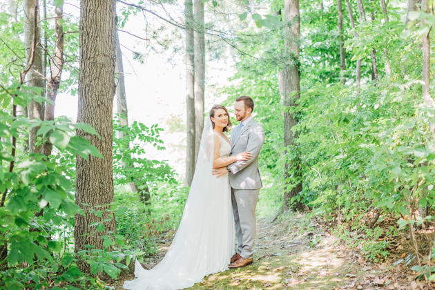 Bride and groom in forest at Stonewall Estates