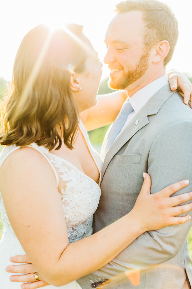 Bride and groom laughing during sunset at Stonewall Estates