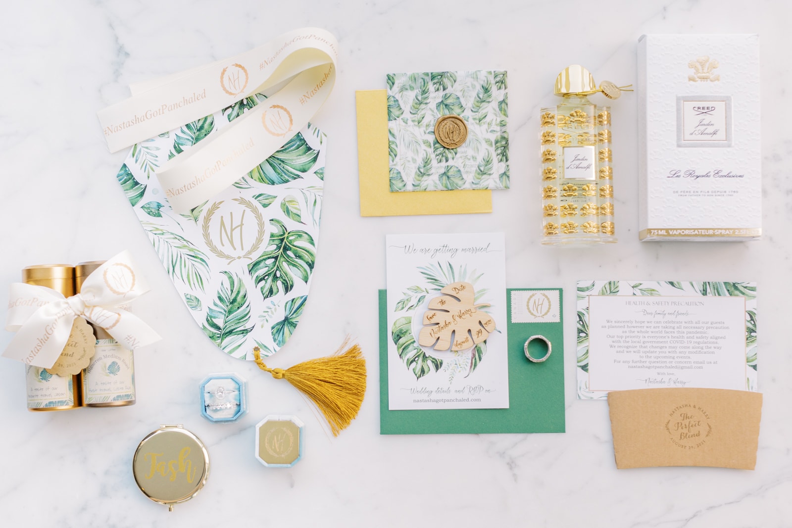 Tropical wedding details with leafy invitations