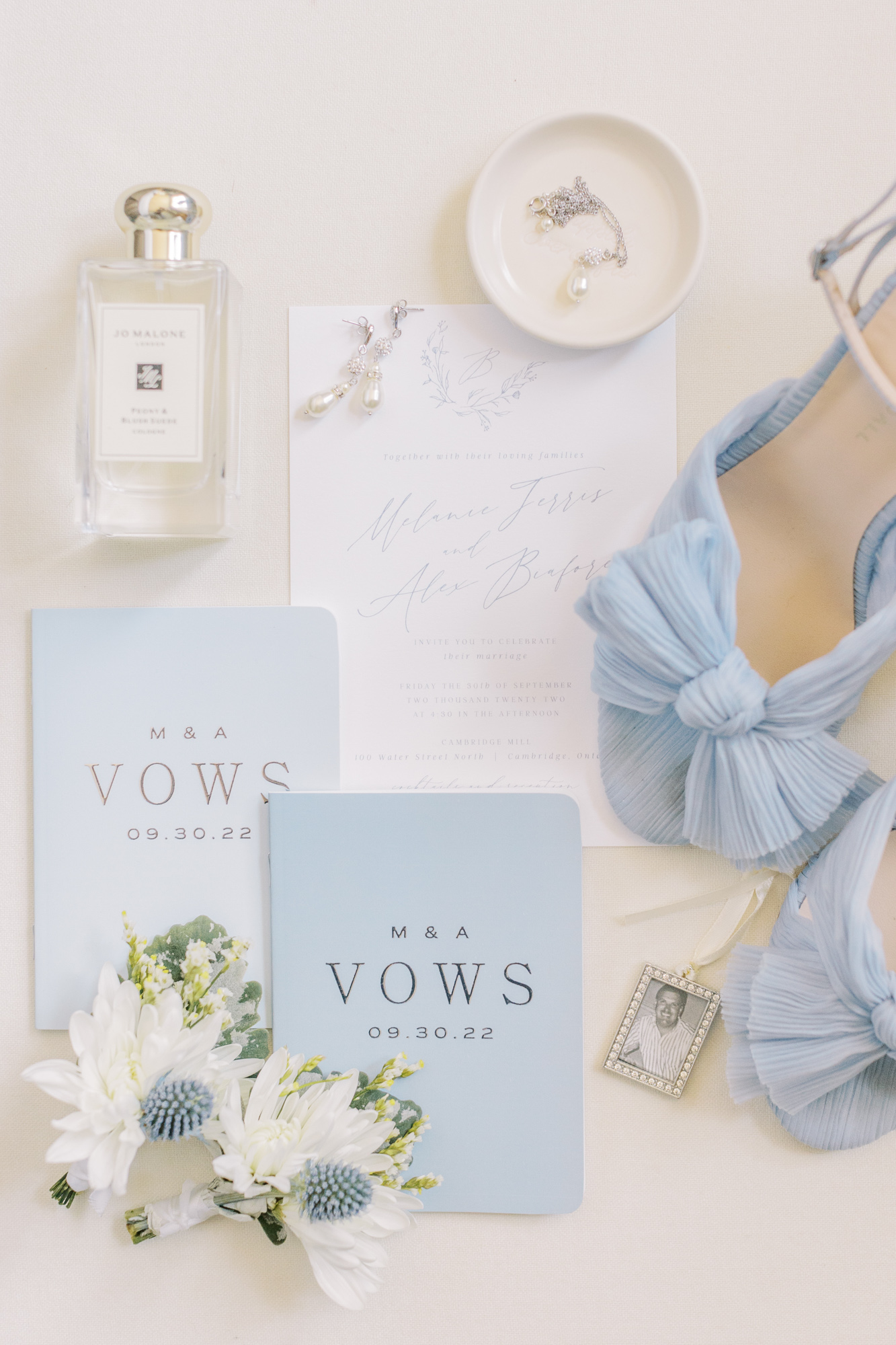 Vow books, bridal shoes, perfumes and bride jewellery flat lay photo from Toronto Wedding Photographer 
