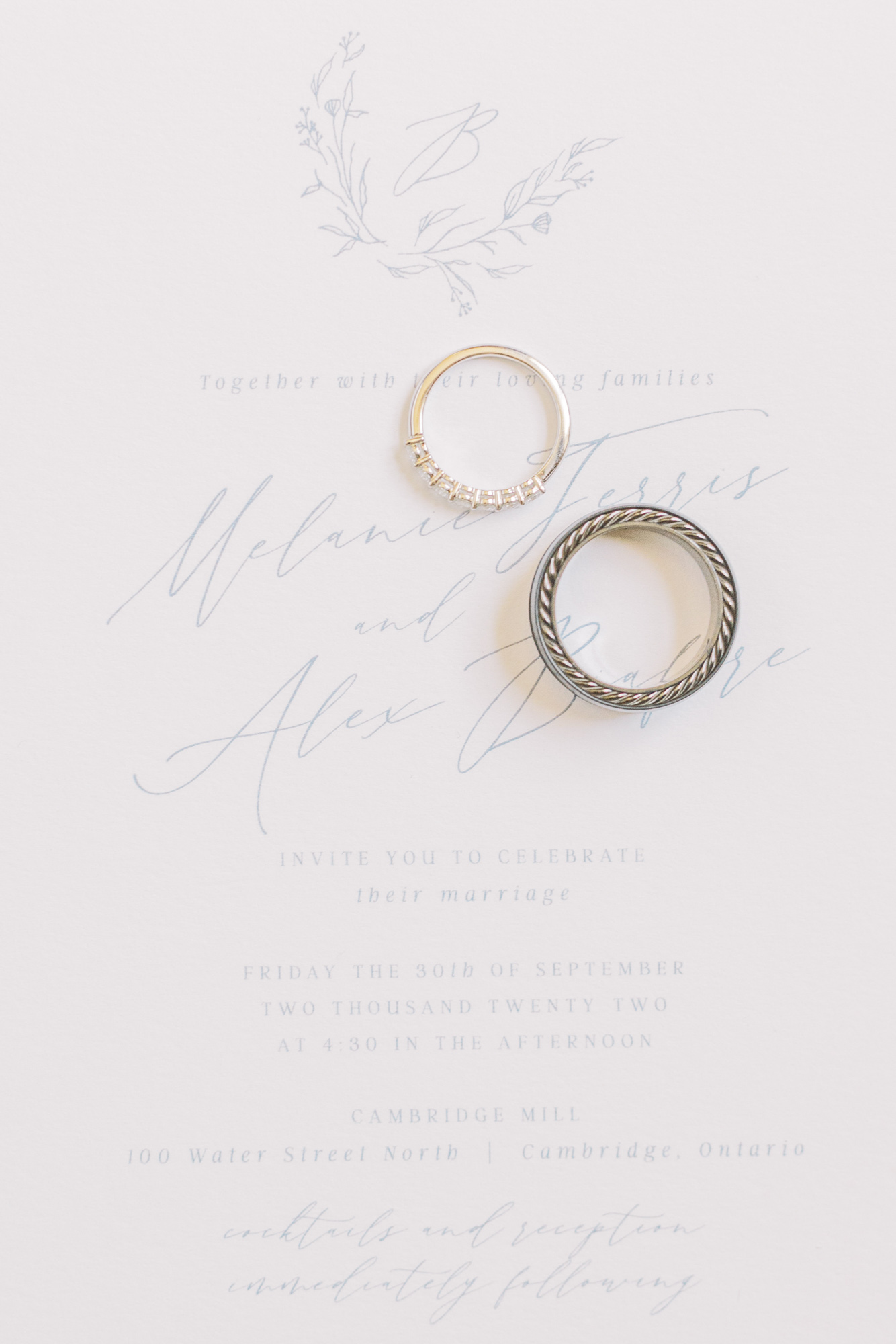 Wedding invitation with wedding rings taken by Toronto Wedding Photographer Paula Visco