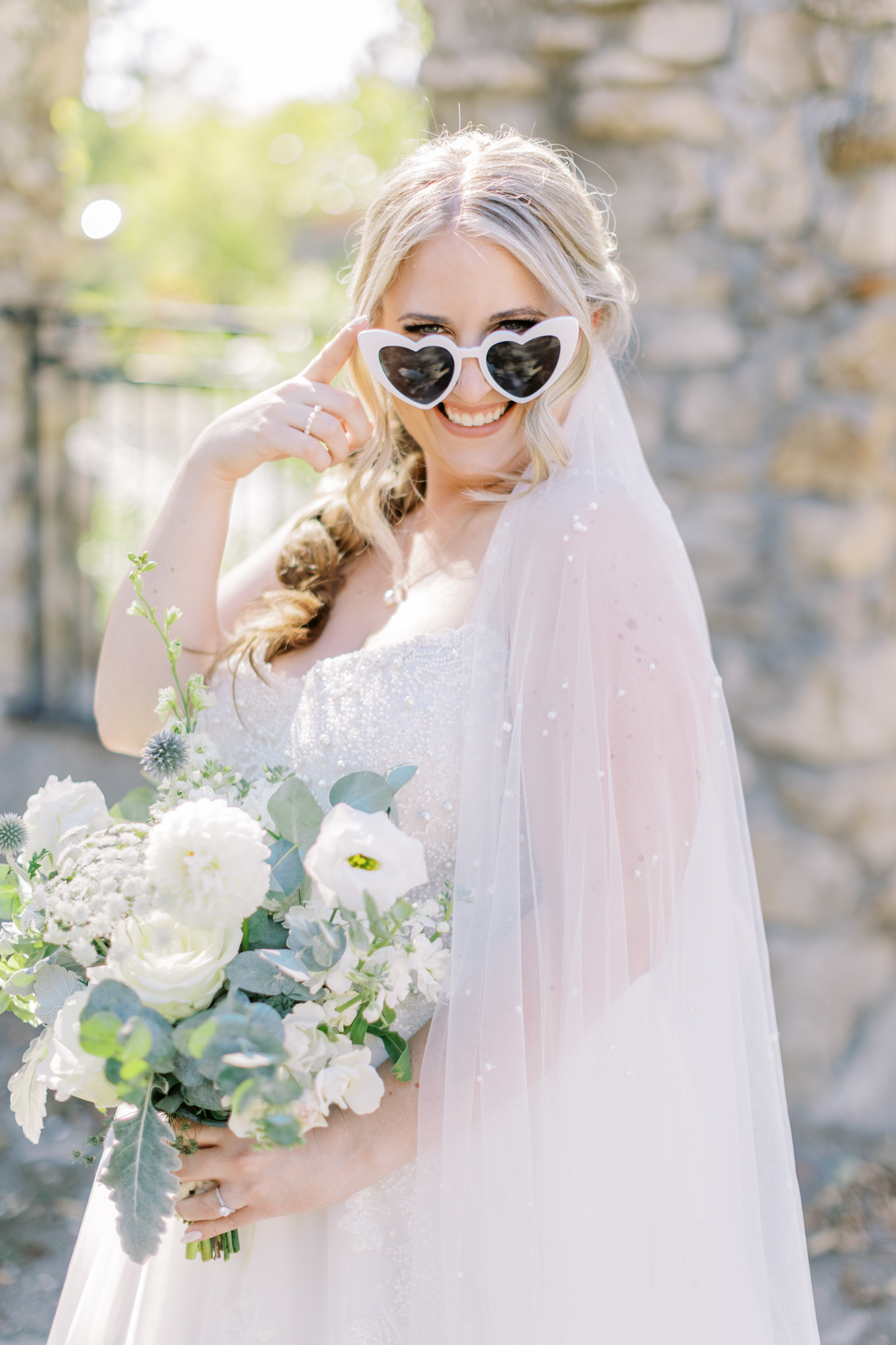Bride with heart shaped glasses at Cambridge Mill Wedding