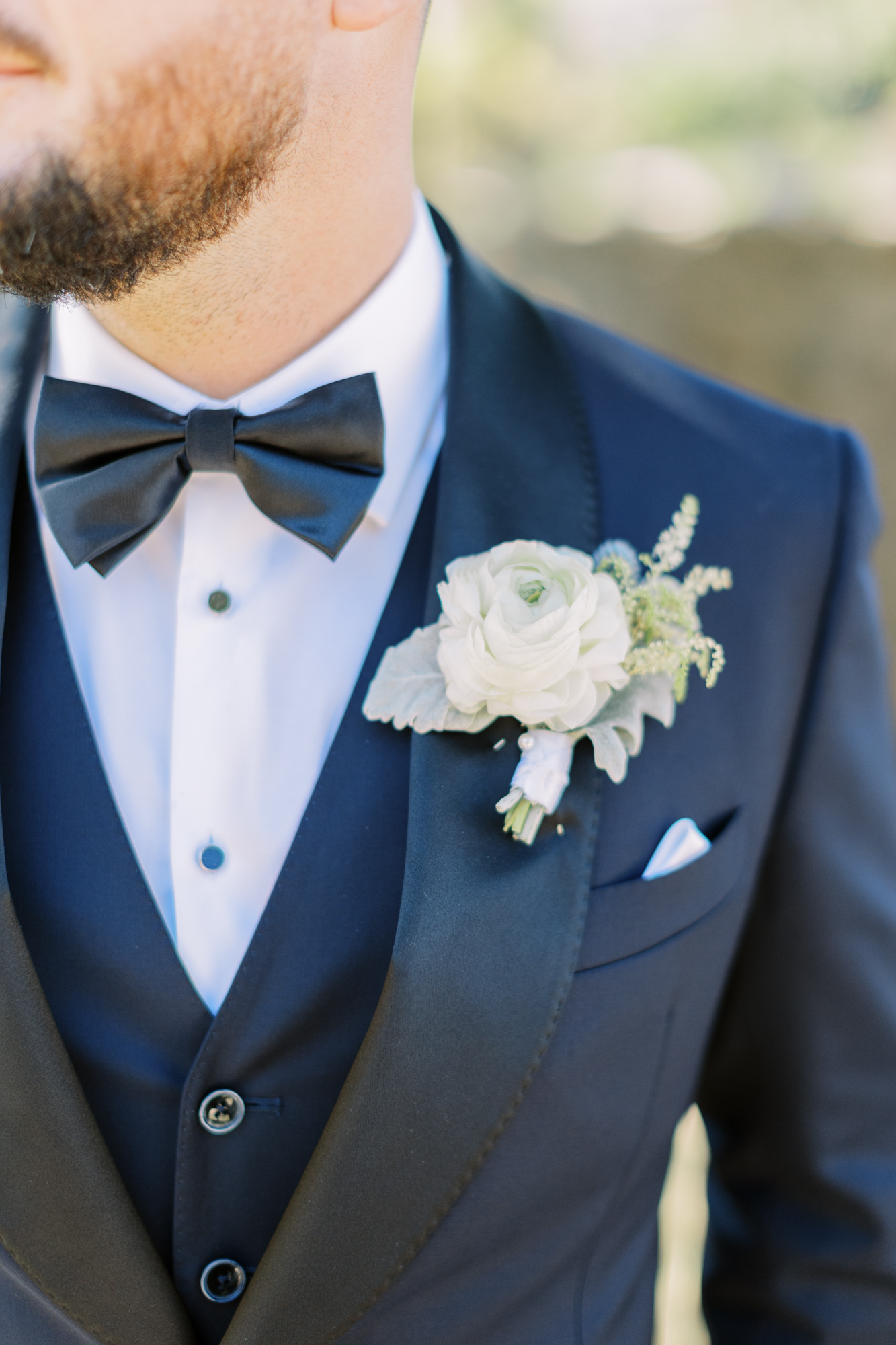 Detail photo of grooms boutonniere and bowtie taken by Toronto wedding photographer Paula VISCO photography