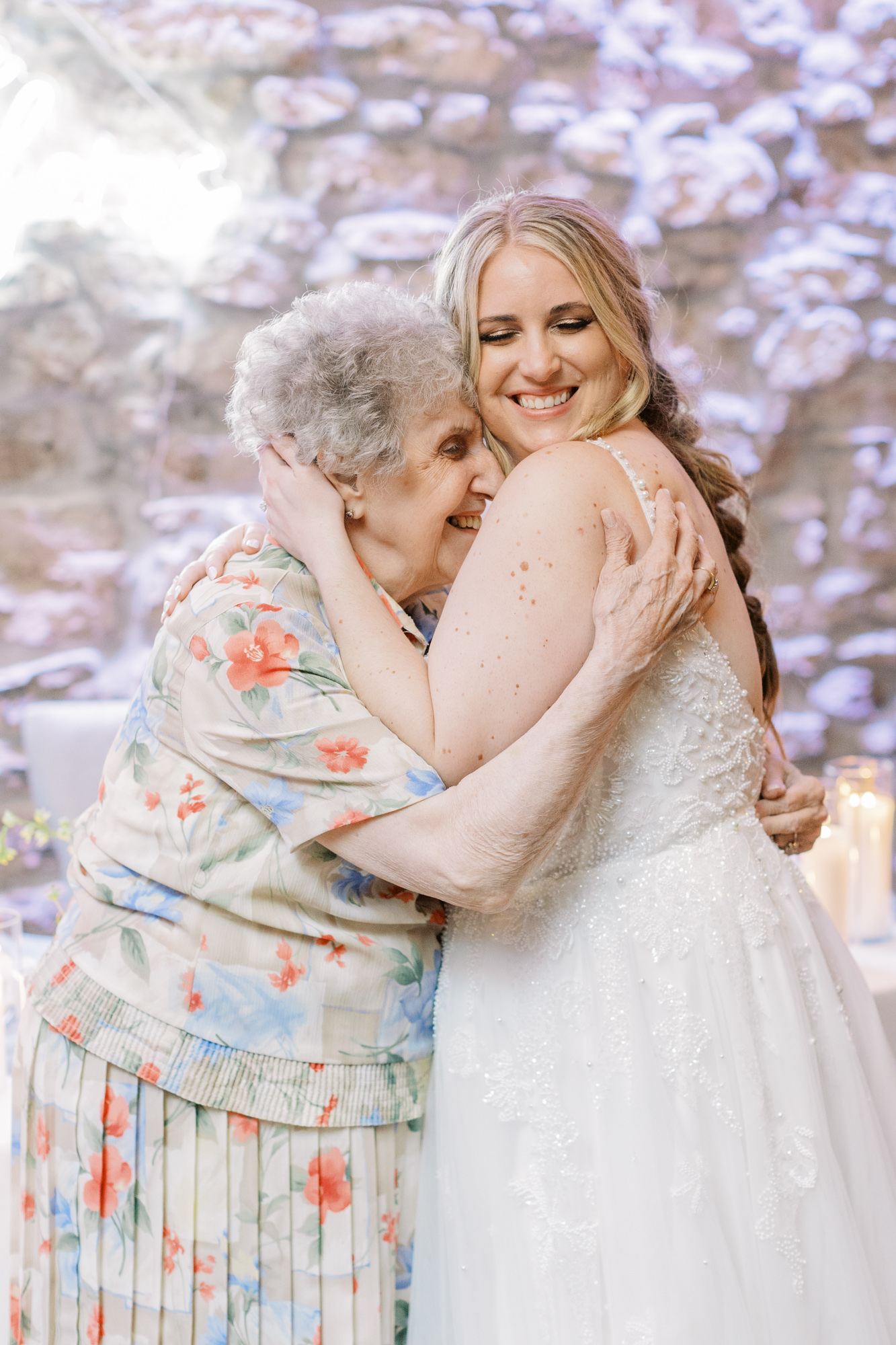 Bride hugging grandma at Cambridge Mill wedding