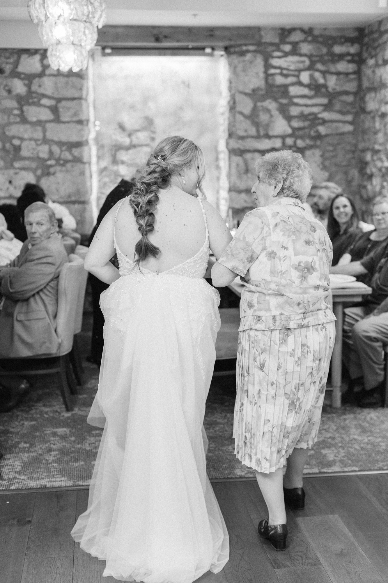 Bride walking with grandma at Cambridge Mill wedding