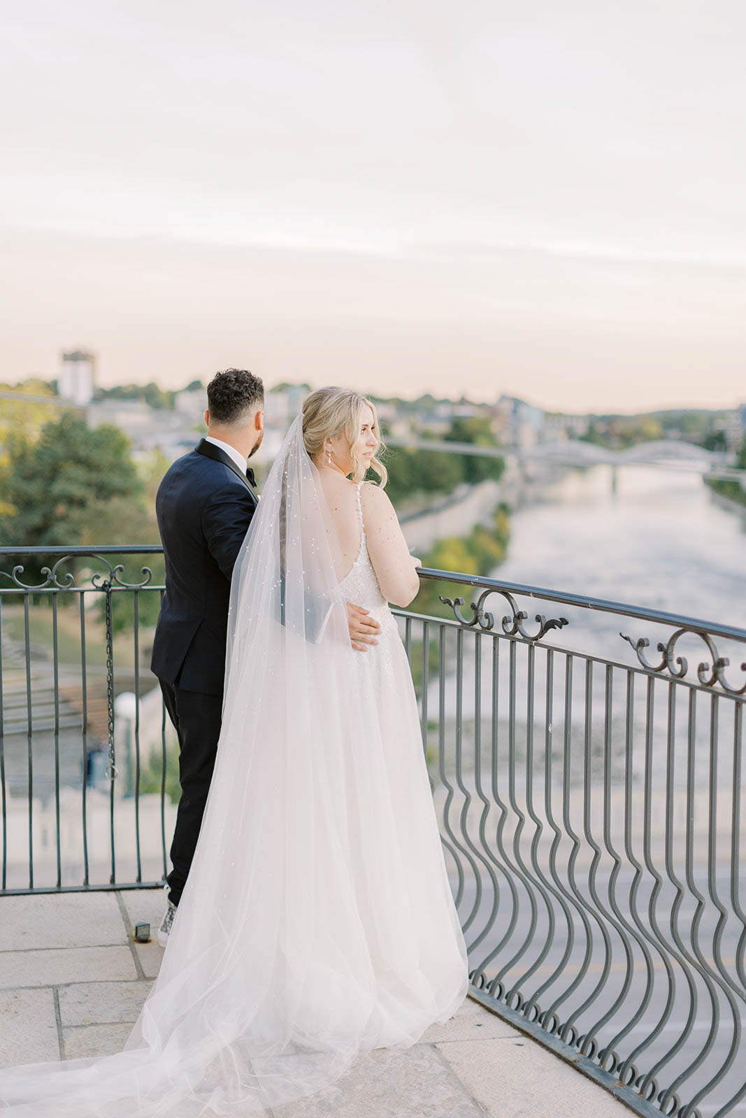 Sunset photos bride and groom on Cambridge Mill Balcony