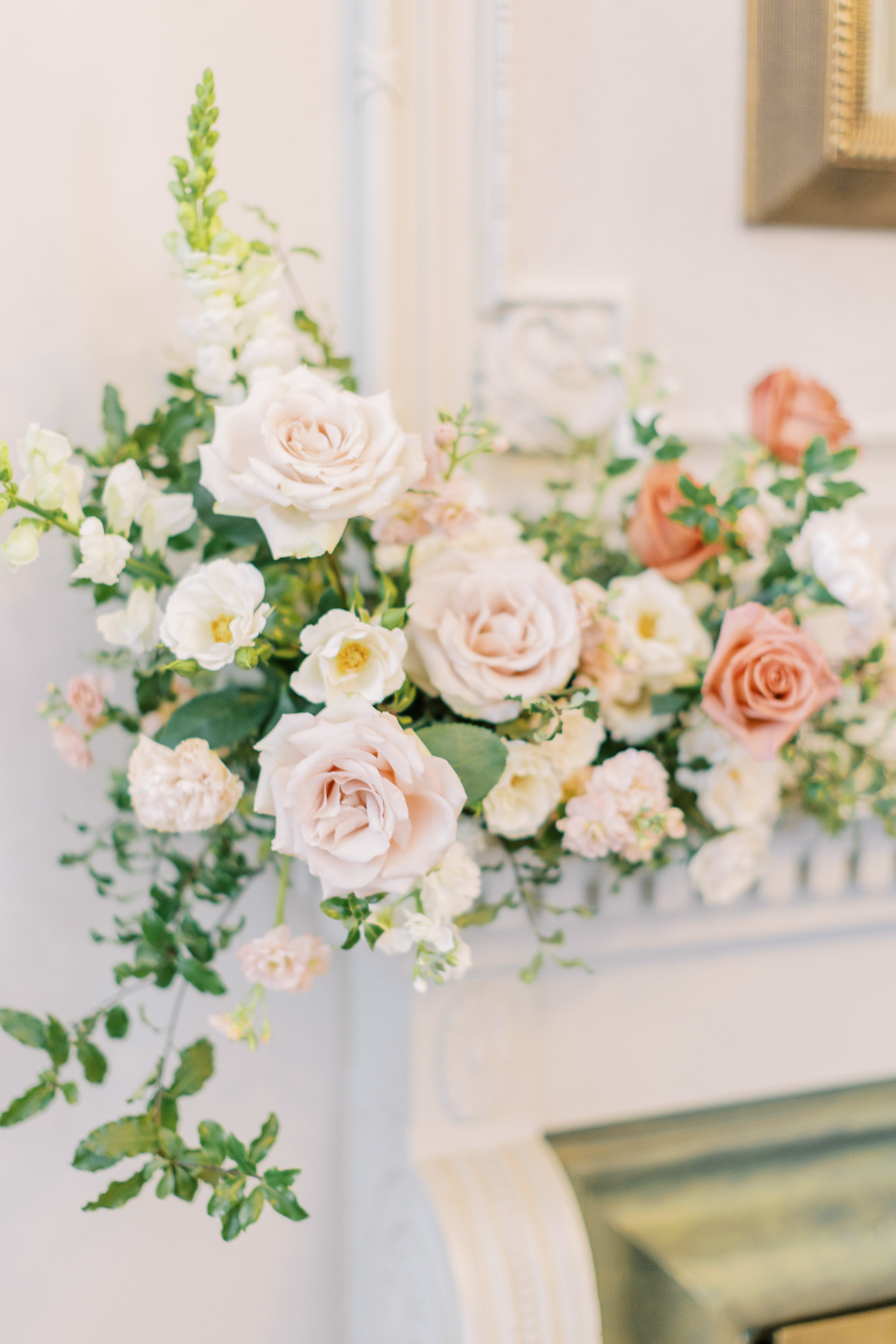 Elegant spring floral arrangements on fireplace at Graydon Hall Manor bridal shower