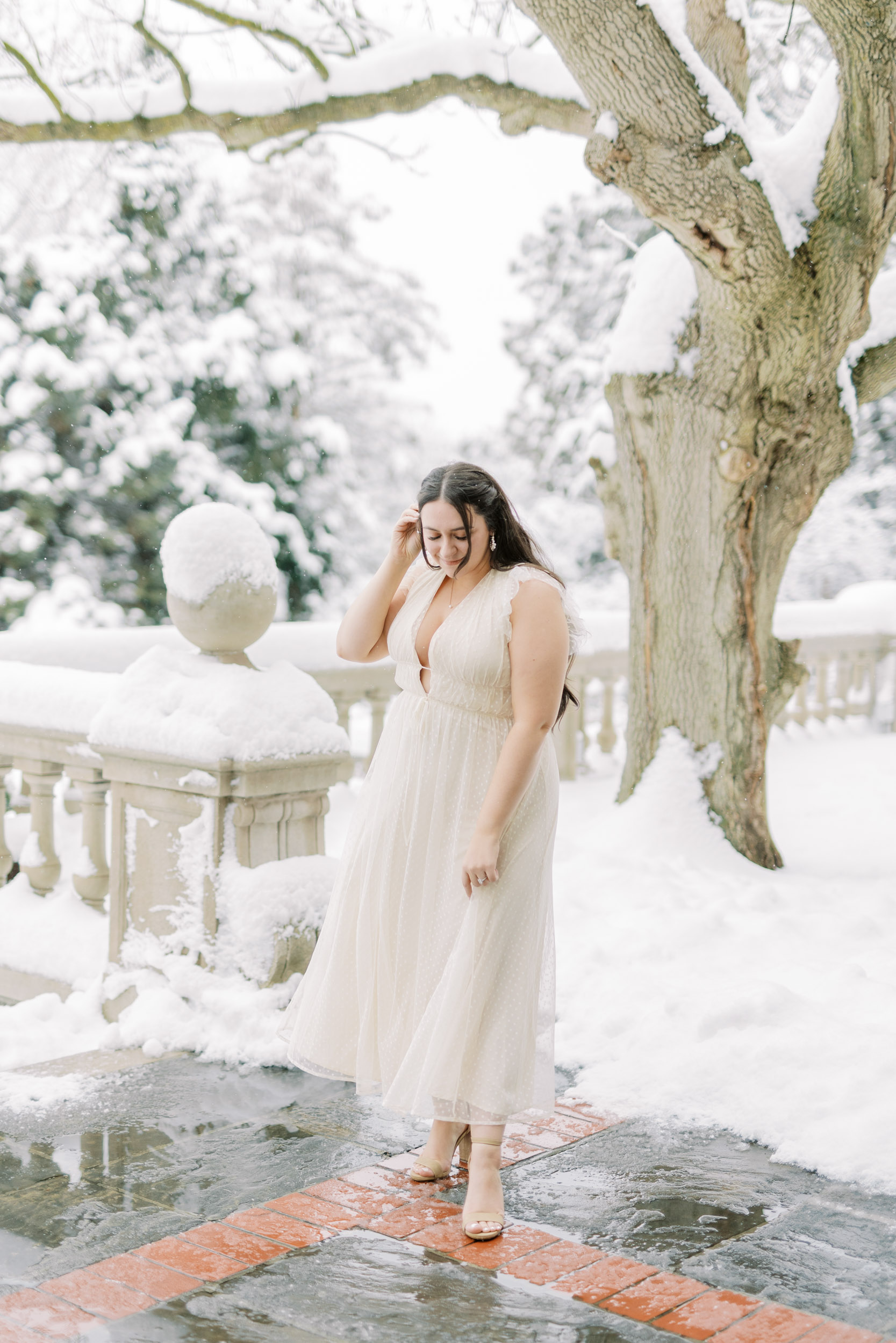 Bride posing with snowy backdrop at Graydon hall