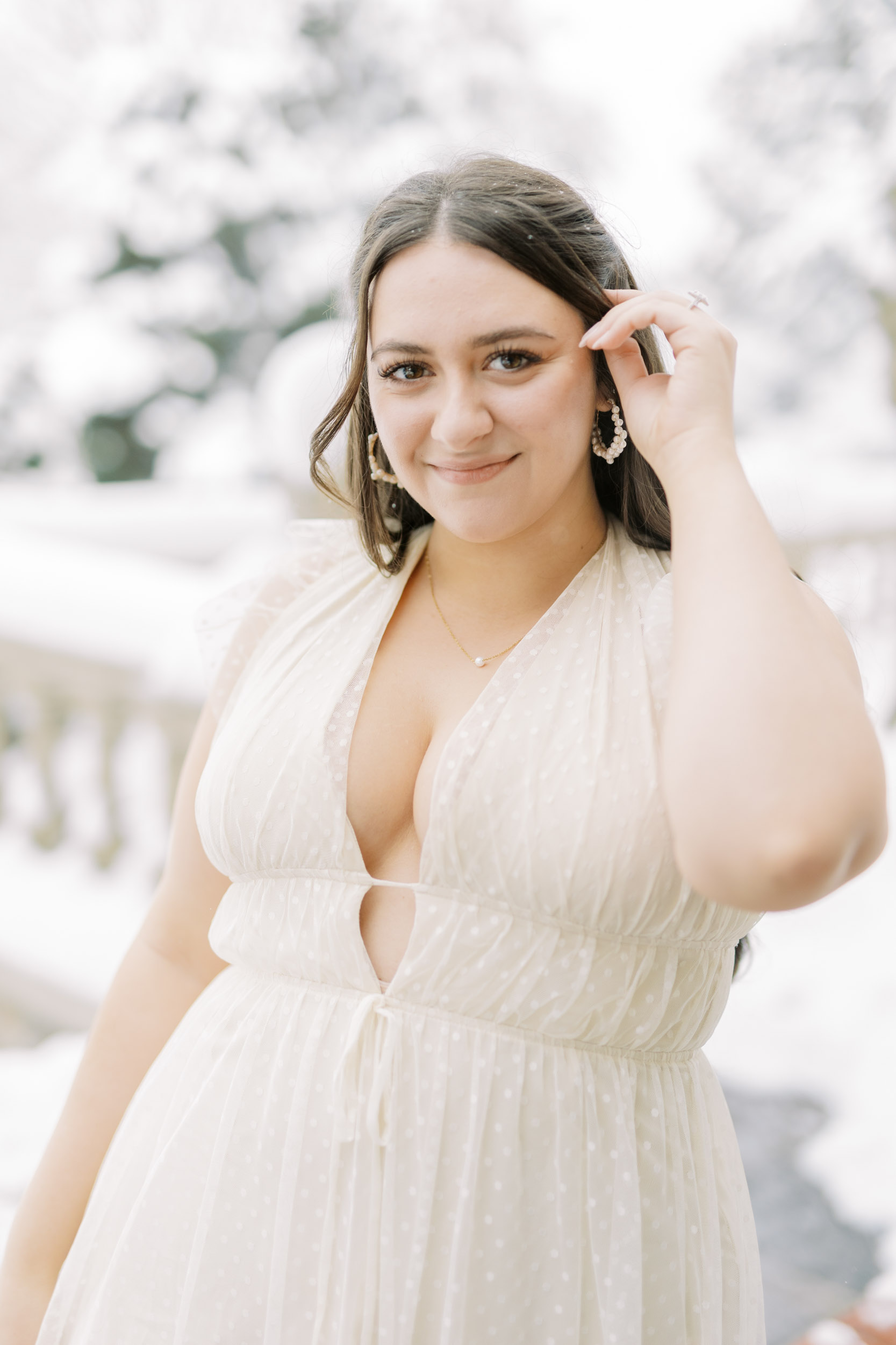 Bride posing with snowy backdrop