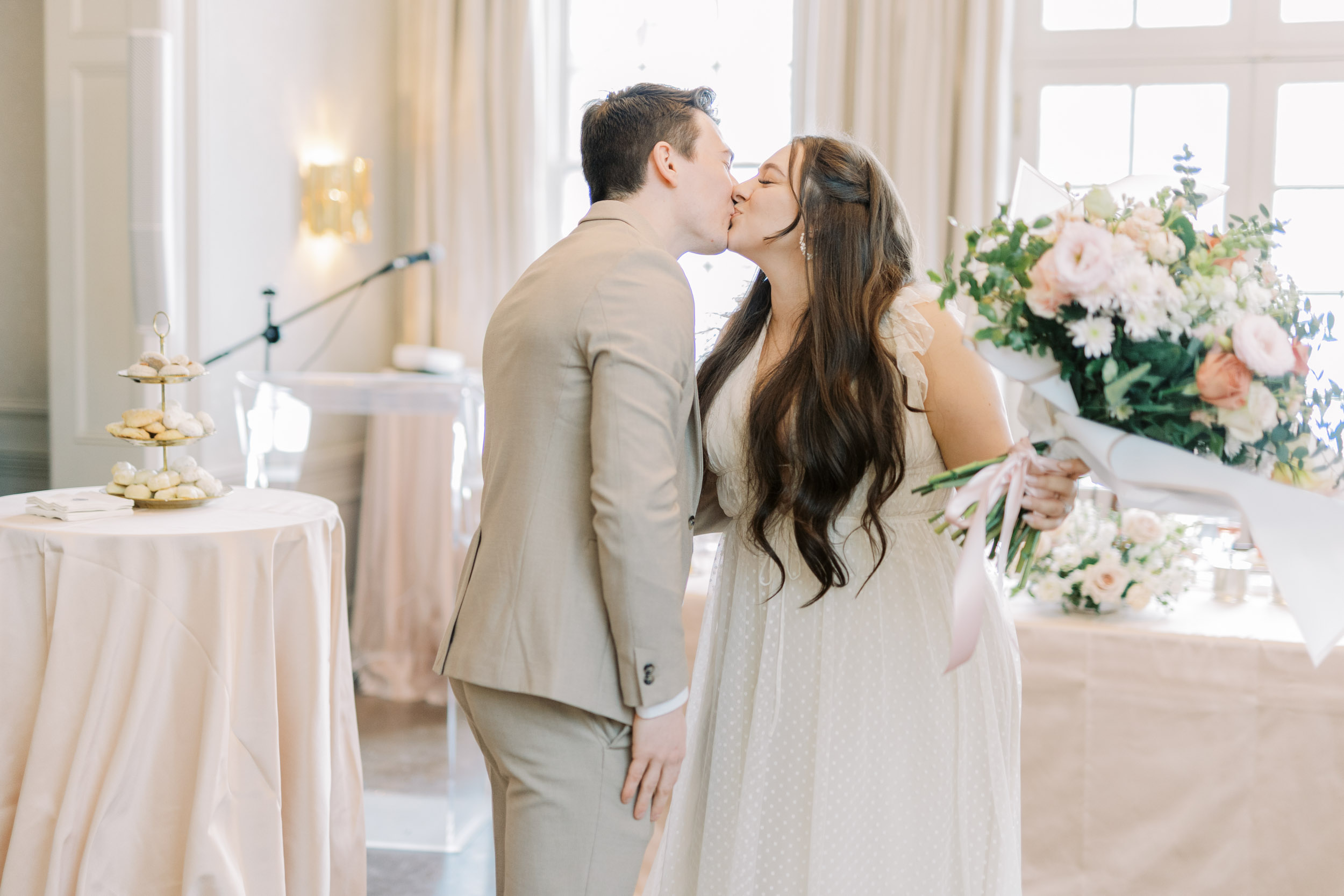 Bride and groom kissing after speech at Bridal Shower