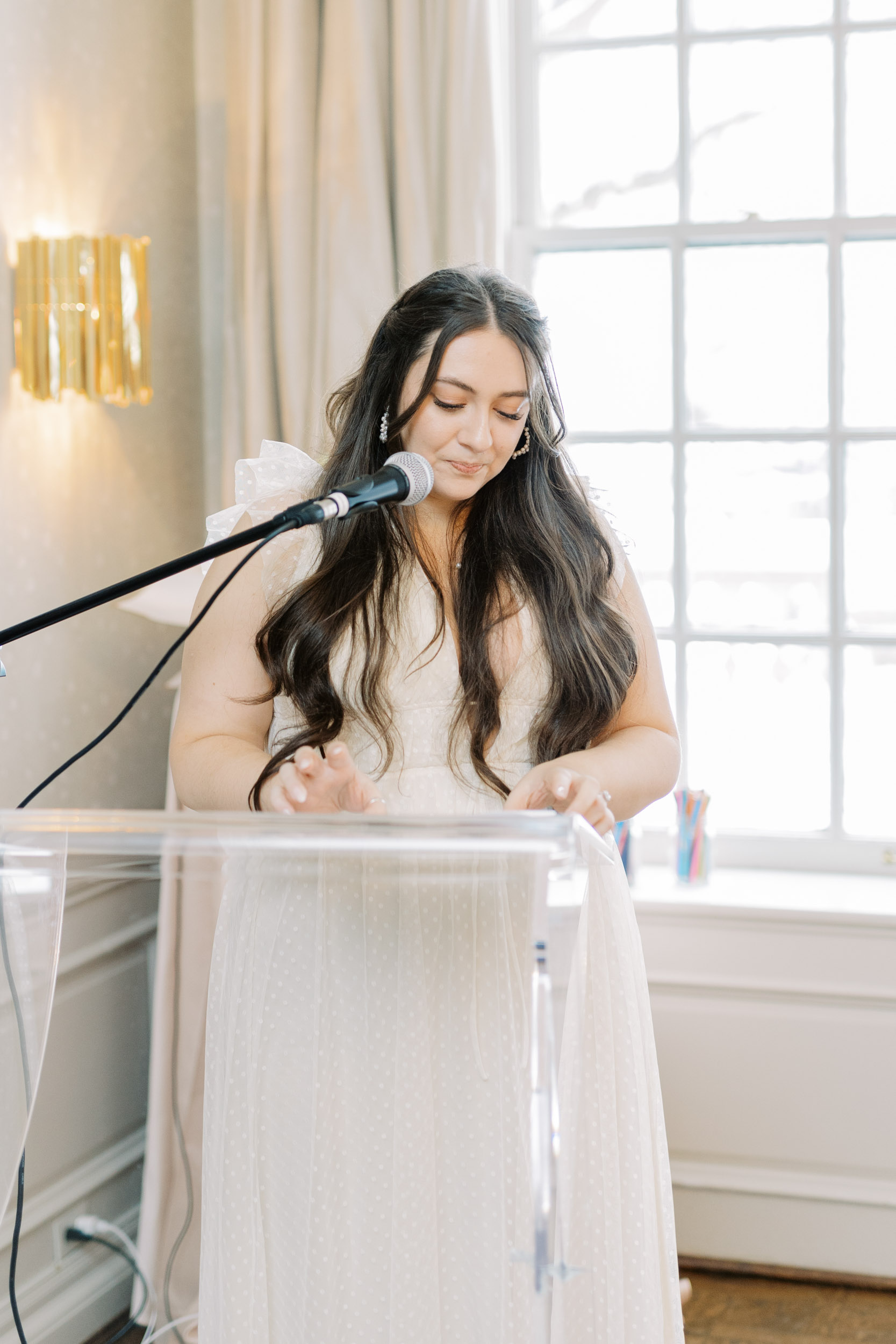 Bride giving speech at her bridal shower