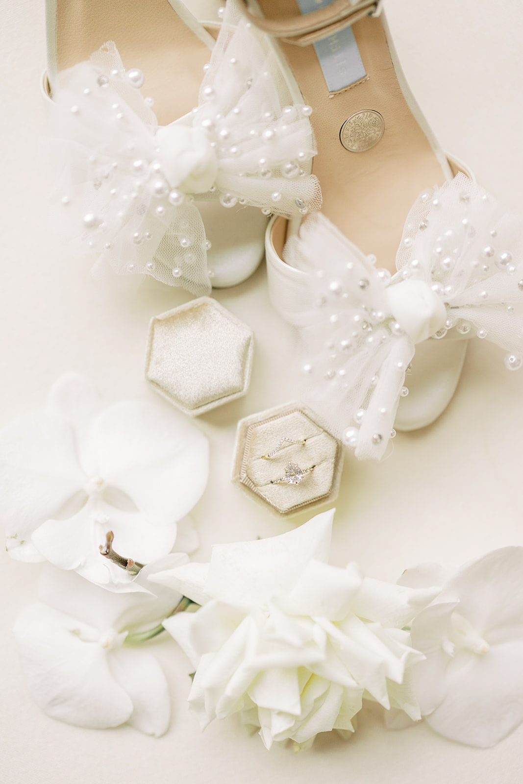 Close up photo of bridal shoes and wedding rings for Elora Mill Wedding Editorial featured in Wedding Chicks