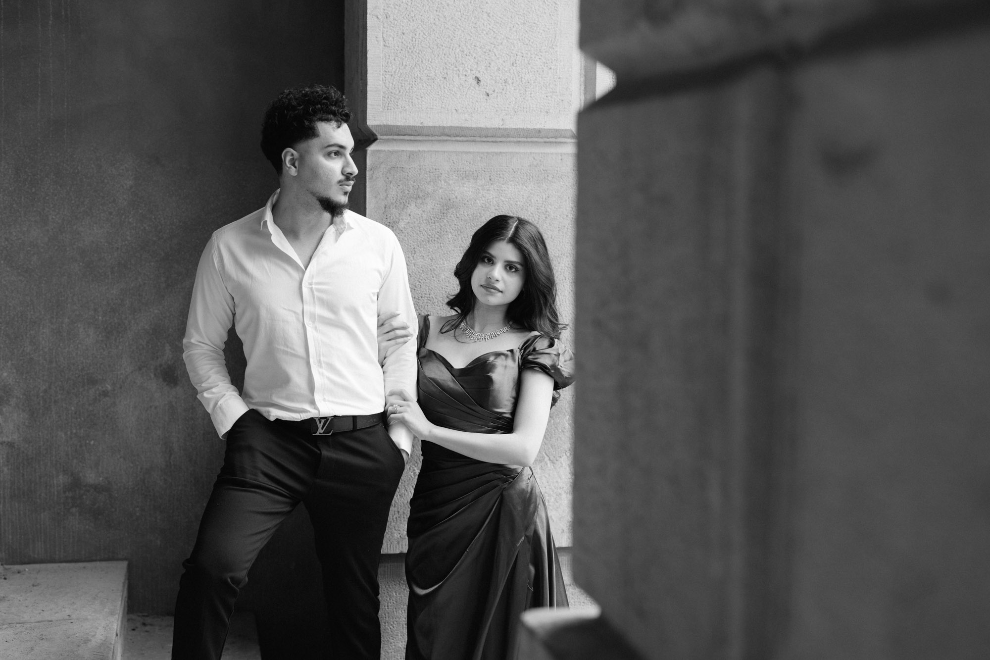 Black and white couple on the staircase posing for camera at Osgoode Hall Engagement Session