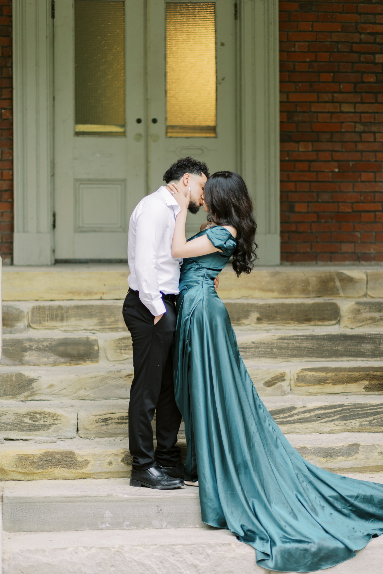 Couple kissing on stairs at Osgoode Hall engagement session