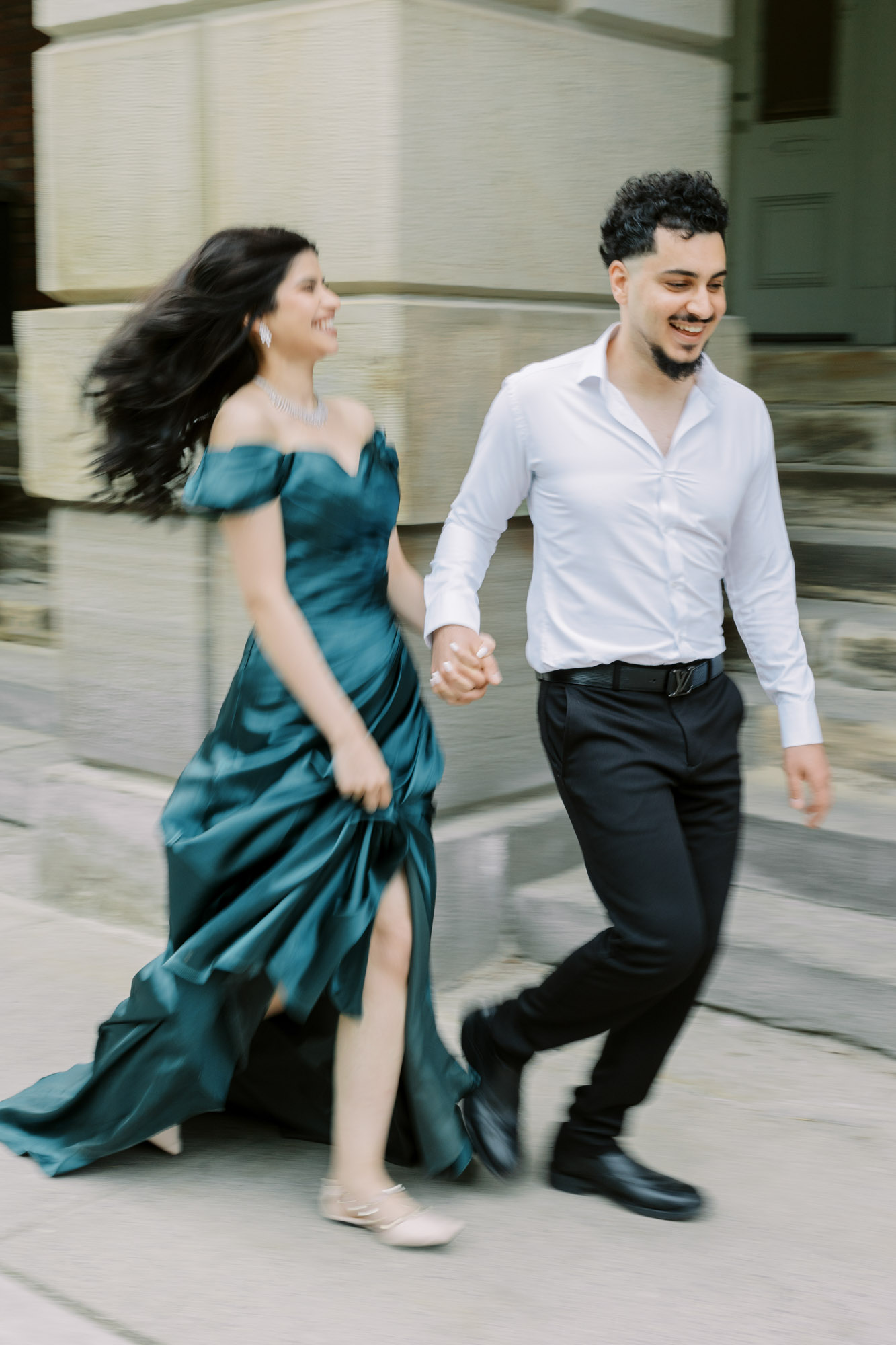 Blurry photo of couple running during engagement session
