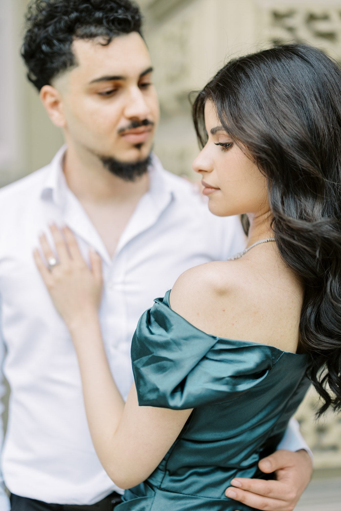 Close up photo of couple holding each other at European inspired Osgoode Hall engagement session