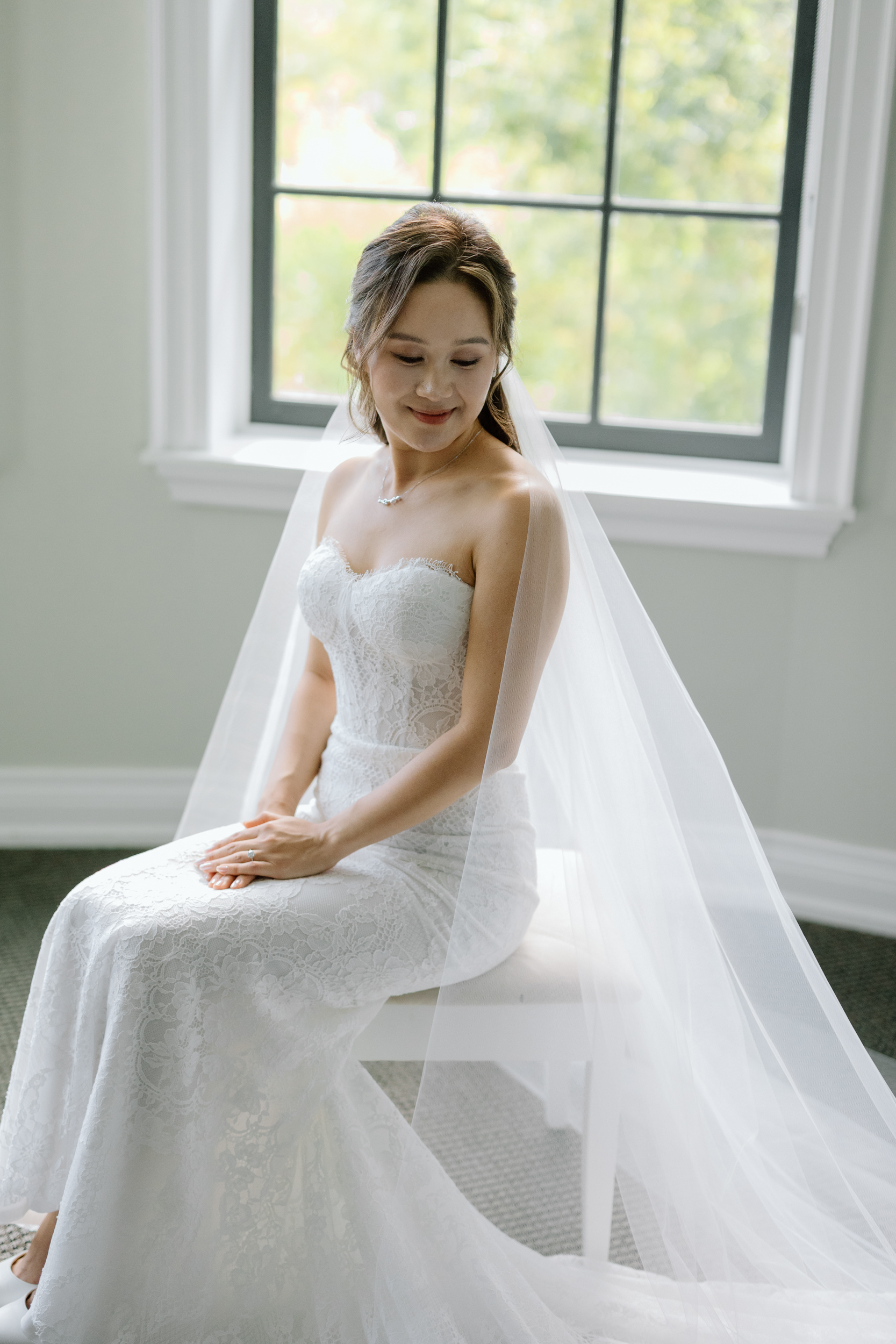 Bridal portrait of bride sitting