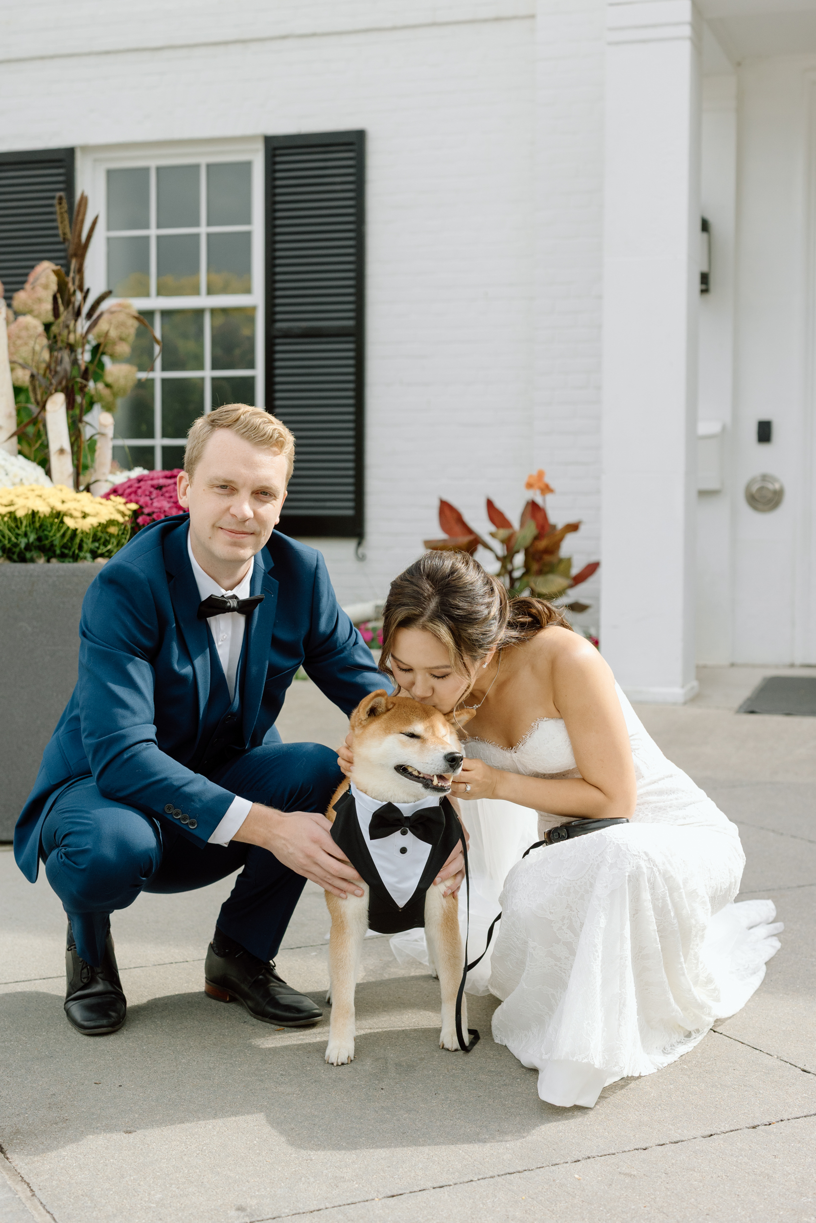 Bride kissing her dog 