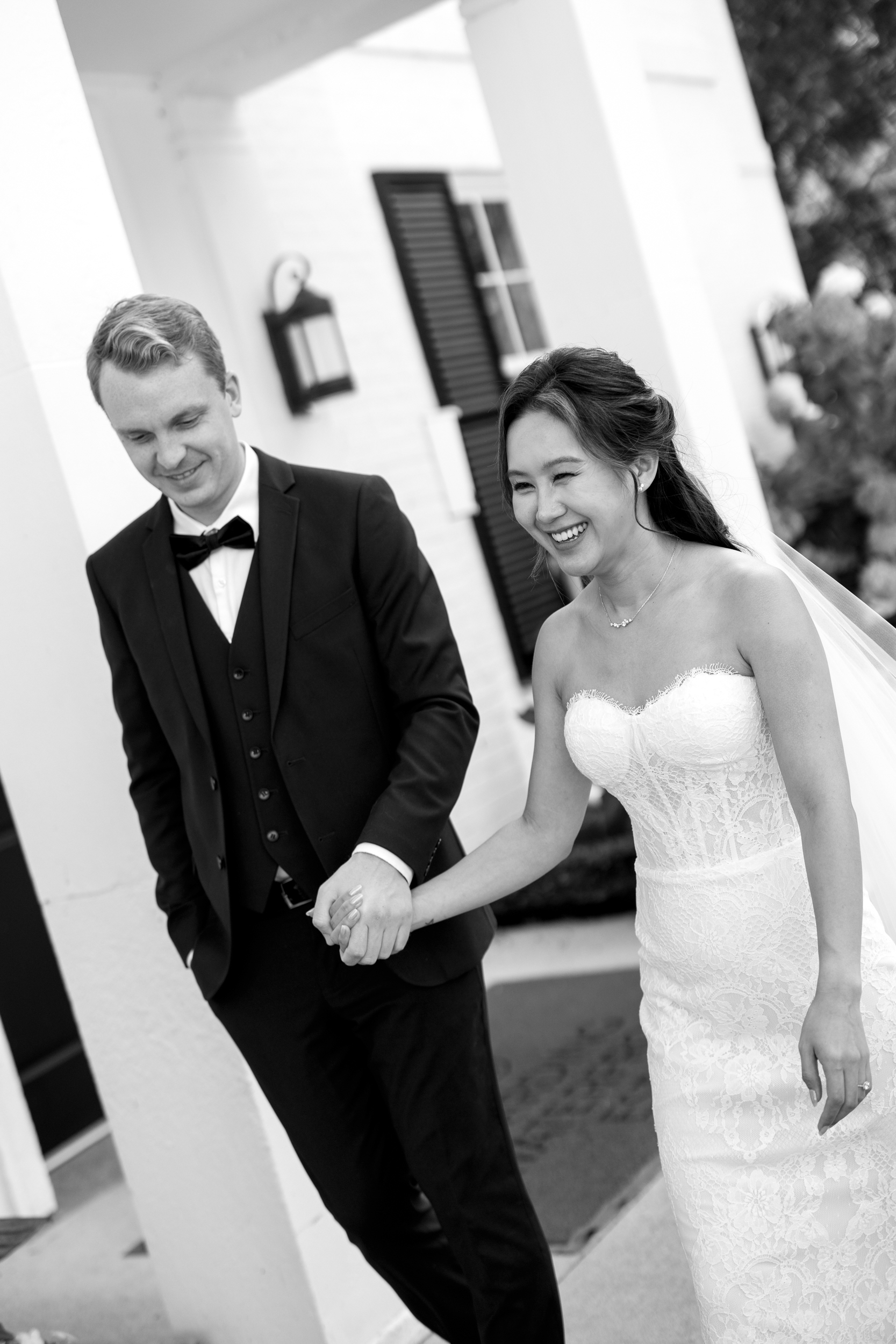 Candid photo of bride and groom walking at Harding Waterfront Estate 