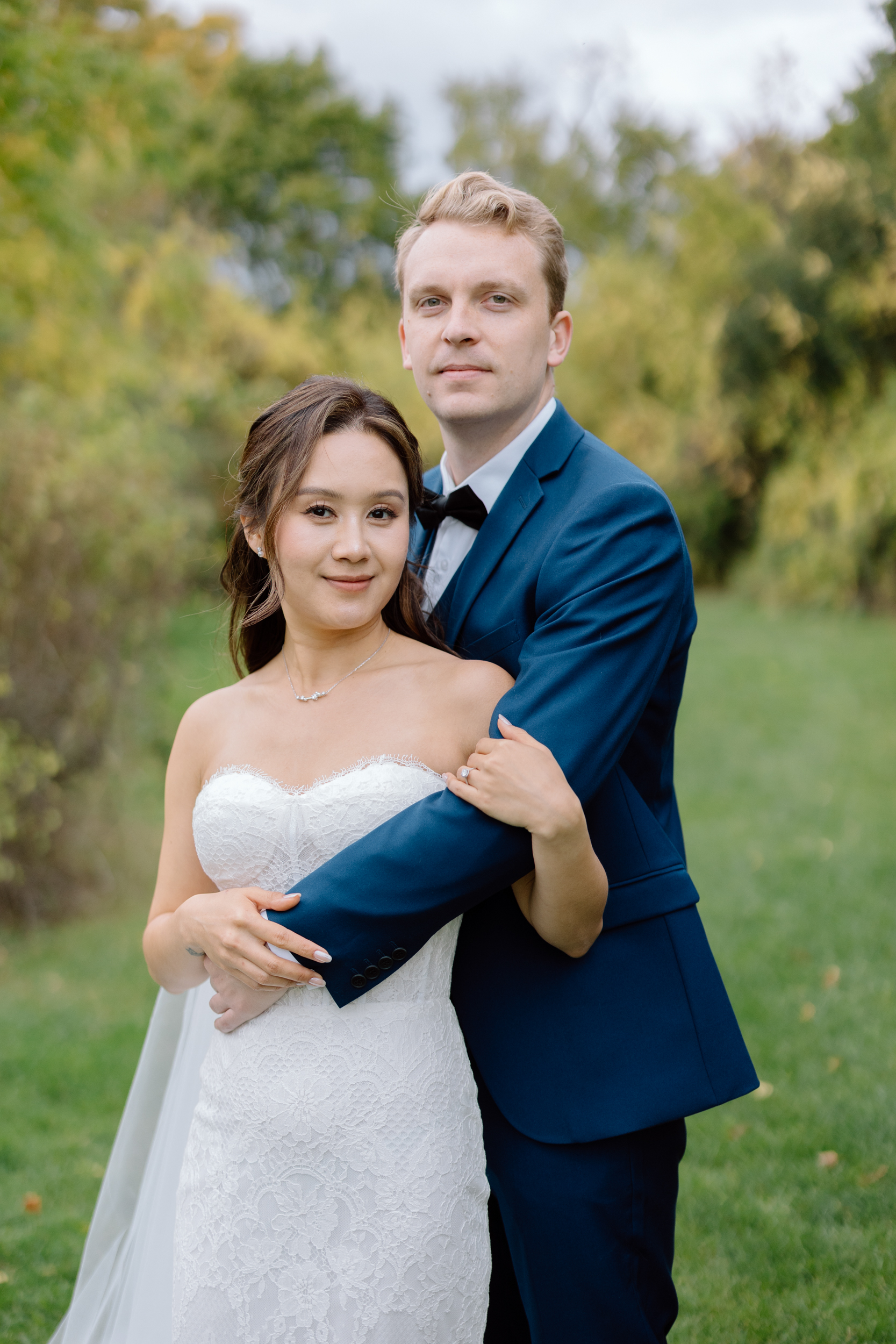 Bride and groom portrait looking at the camera 