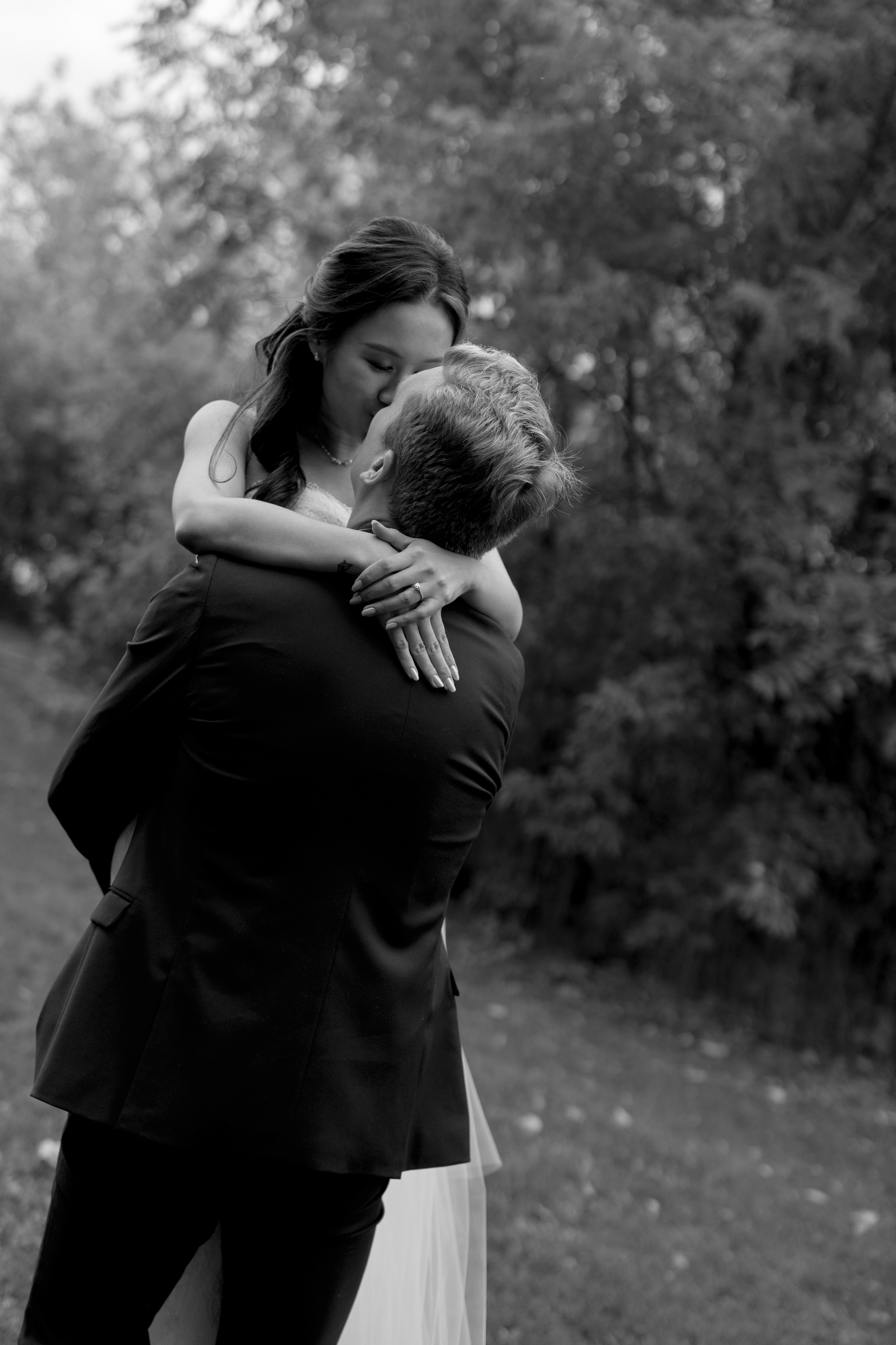 Bride and groom kissing 