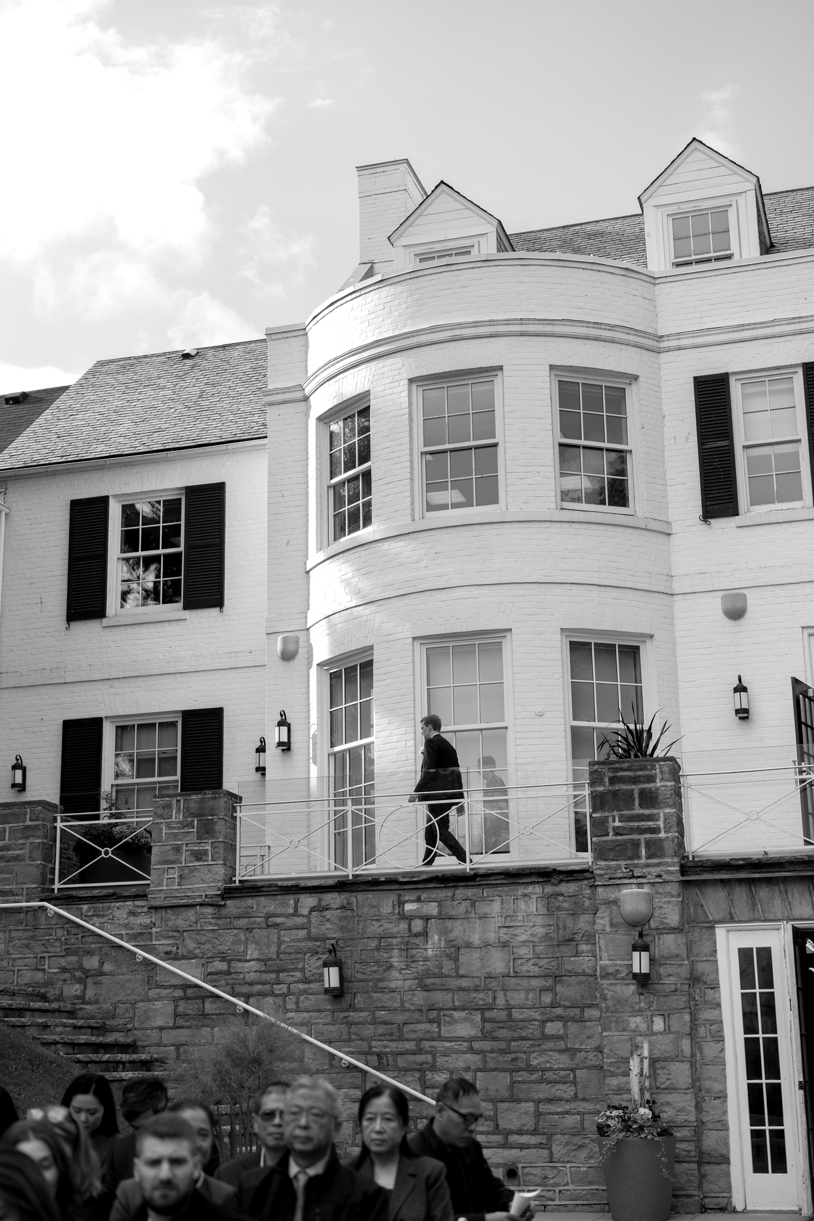 Groom walking out of Harding Waterfront Estate house