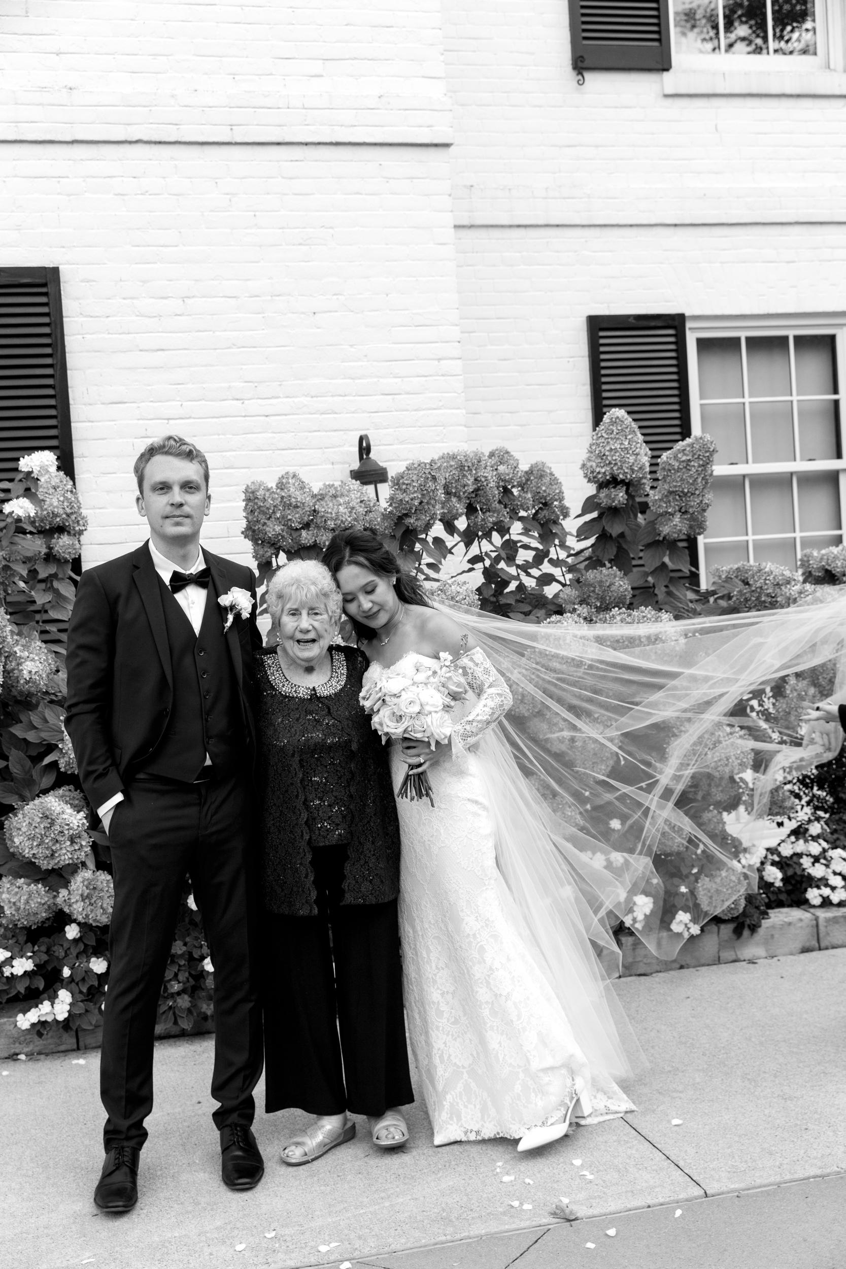 Bride, groom, and grandmother posing at Harding Waterfront Estate wedding