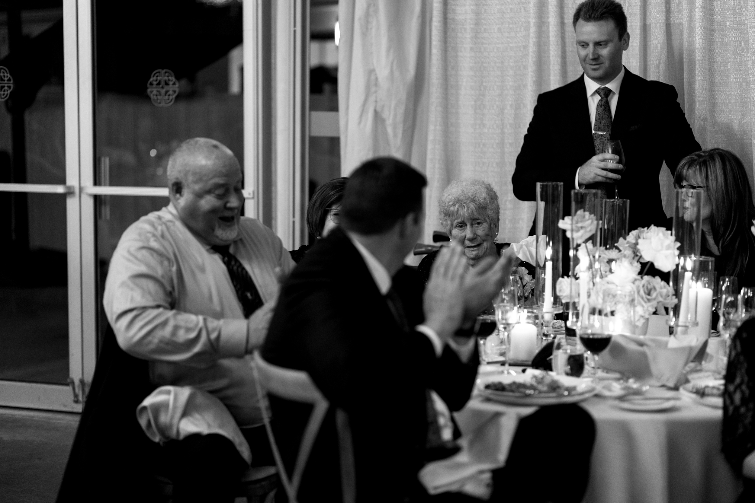 Guest reaction during speeches at Harding Waterfront Estate wedding