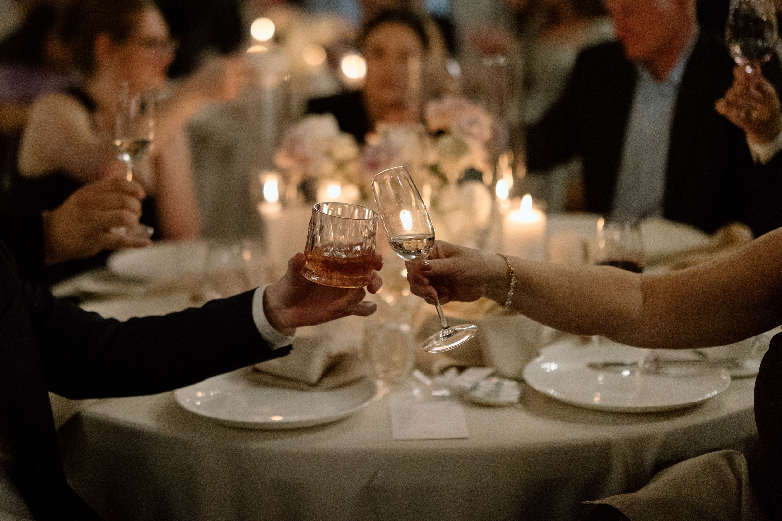 Guests cheering eaching other at reception 
